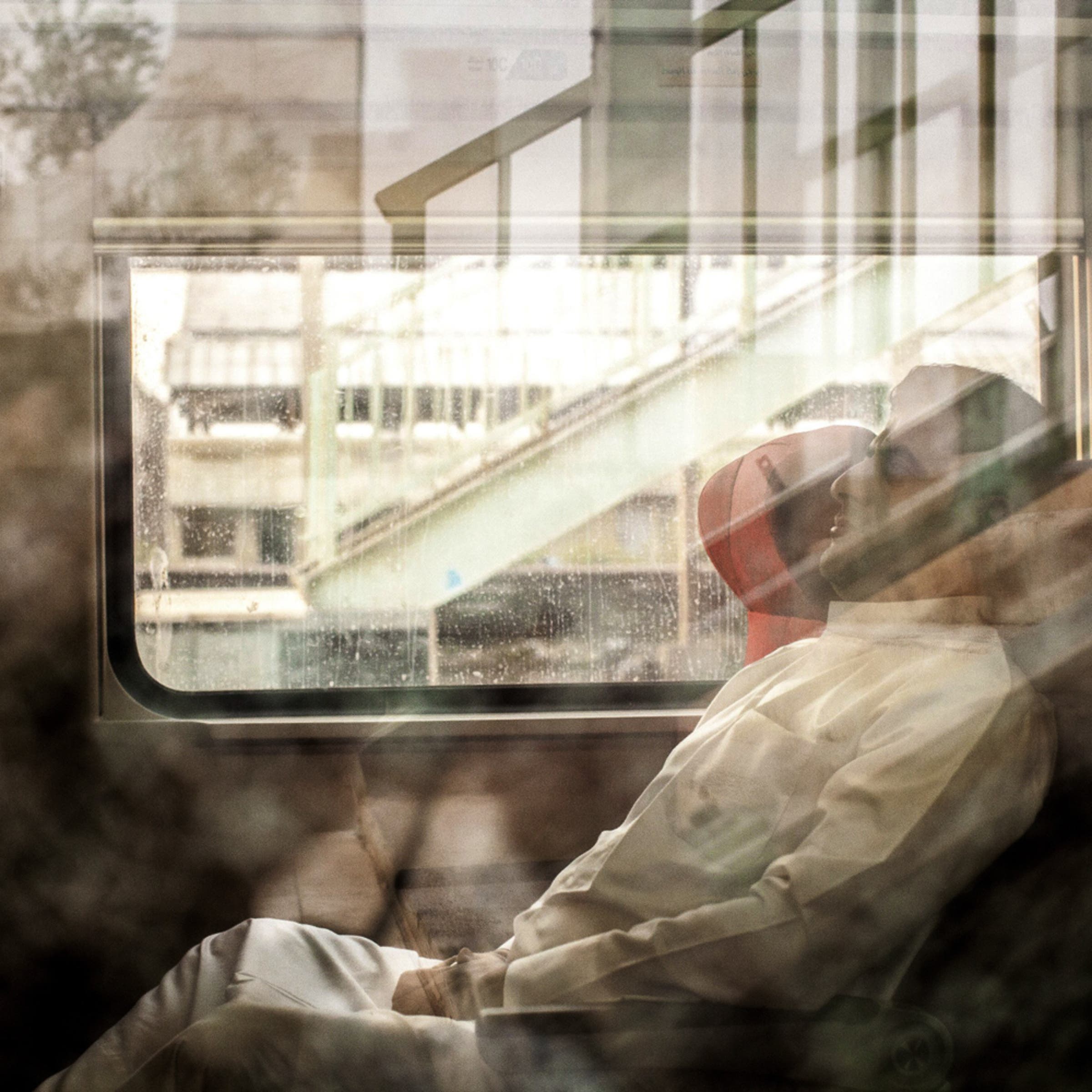 A girl looks out from a sleeping compartment on a new train preparing to leave from Basra to Baghdad, the only passenger rail service currently operational in Iraq.