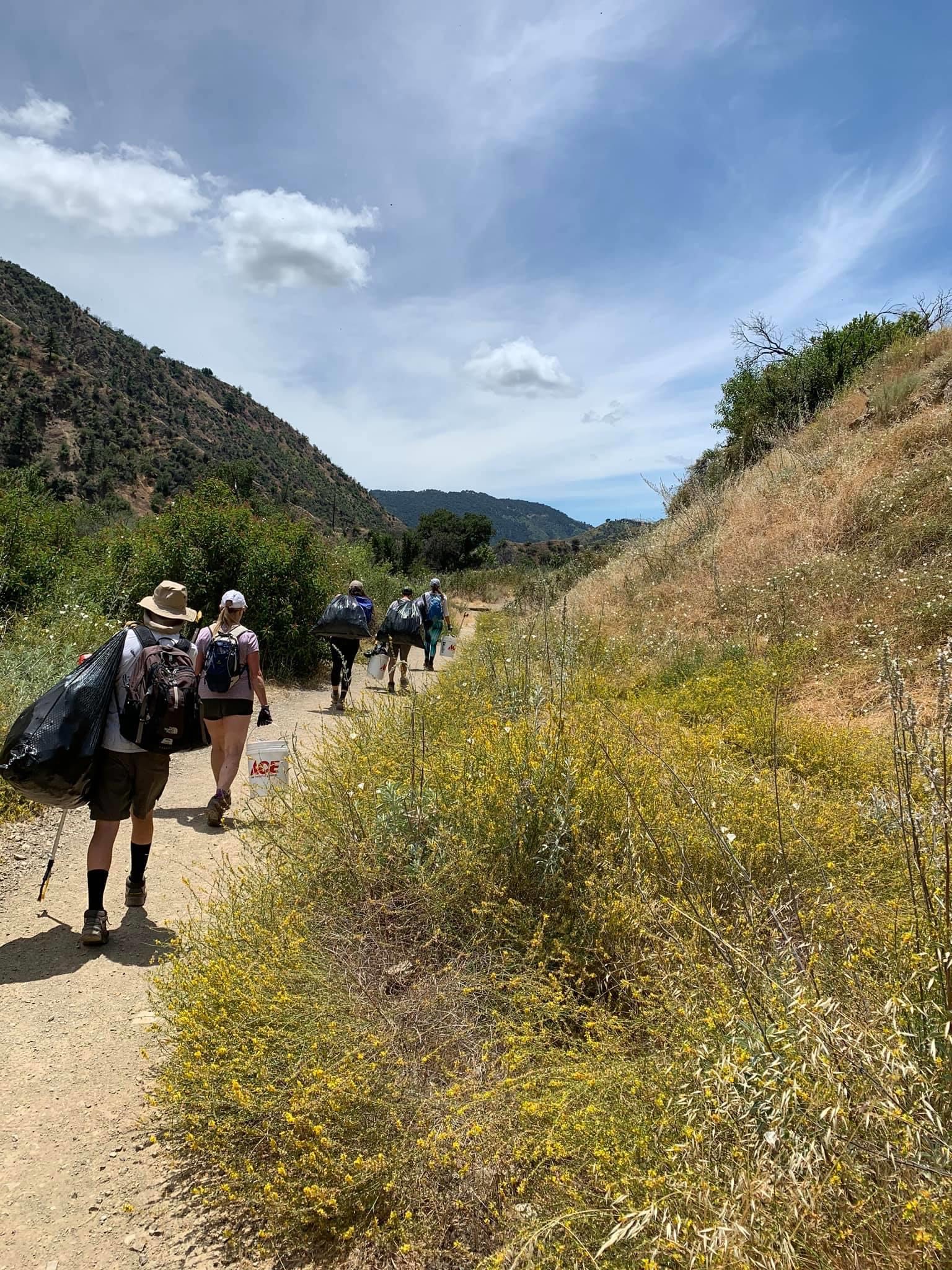 Volunteers work to clean up trash at the Santa Paula Canyon in California in 2020. 