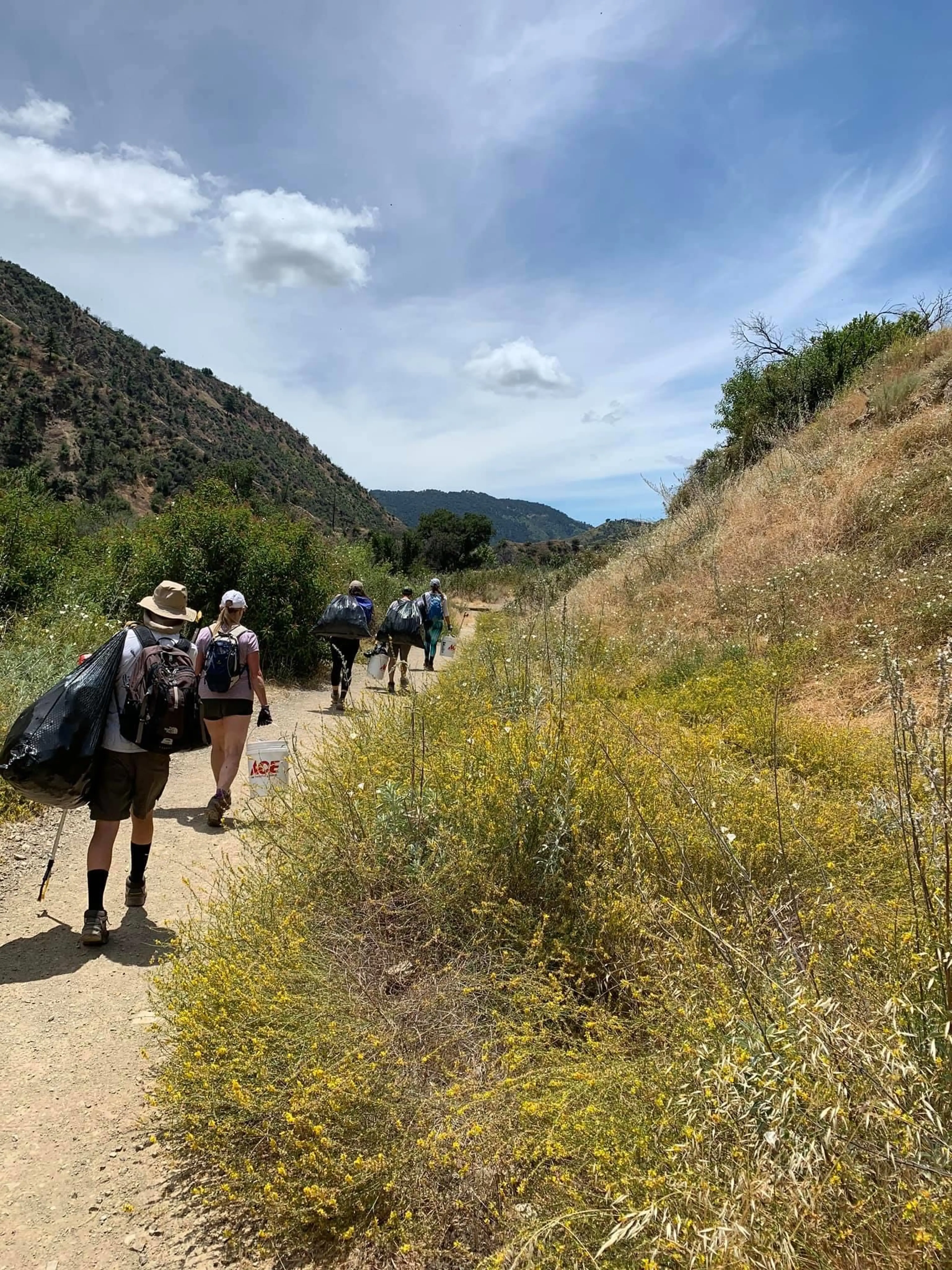 Volunteers work to clean up trash at the Santa Paula Canyon in California in 2020.