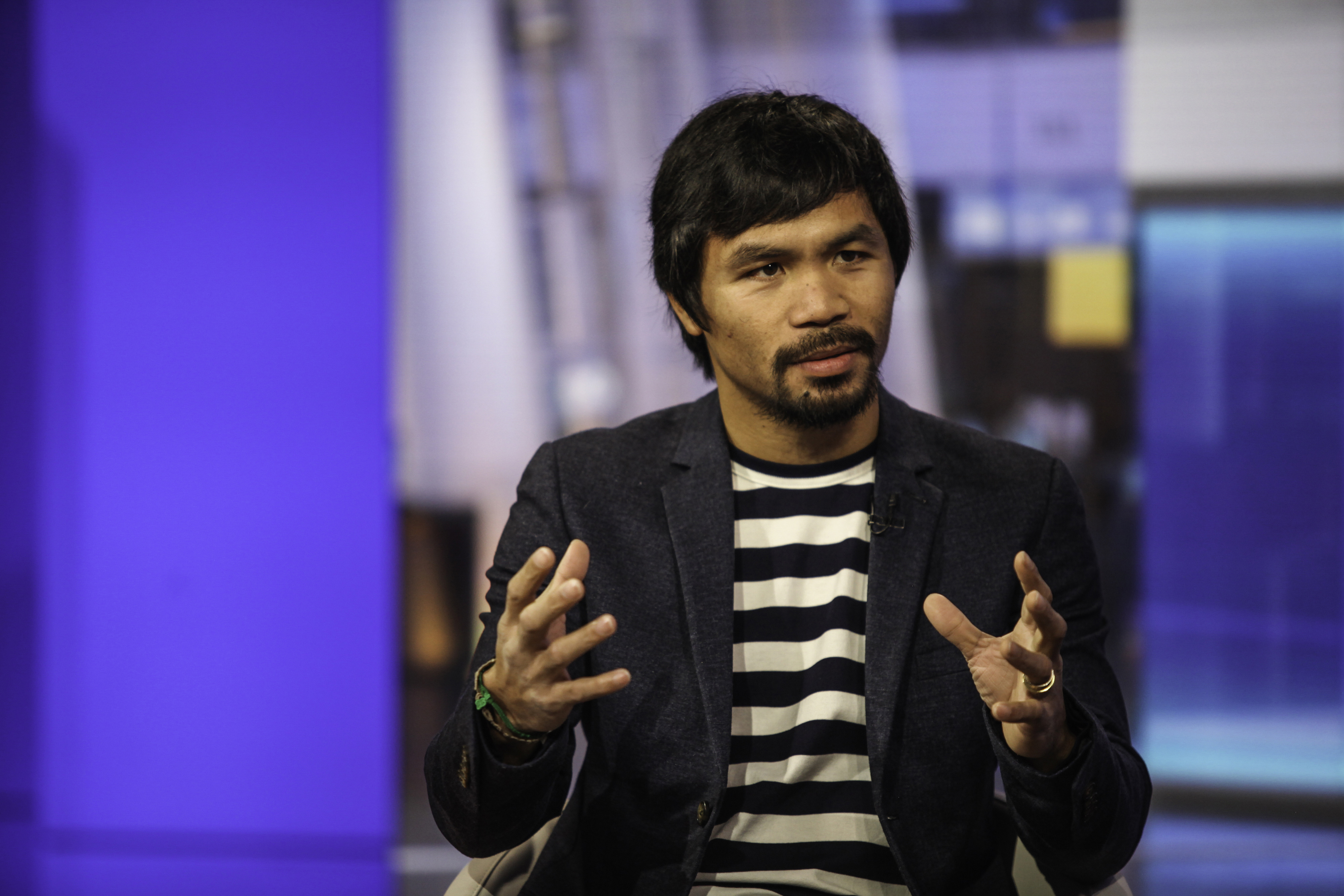 Professional boxer Manny Pacquiao speaks during a Bloomberg Television interview in New York, U.S., on Tuesday, Oct. 13, 2015. Pacquiao discussed his career as a boxer and politician and what motivates him to do charity work. Photographer: Chris Goodney/
