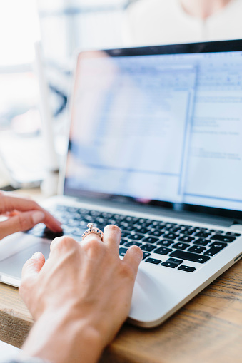 woman-hands-laptop-typing