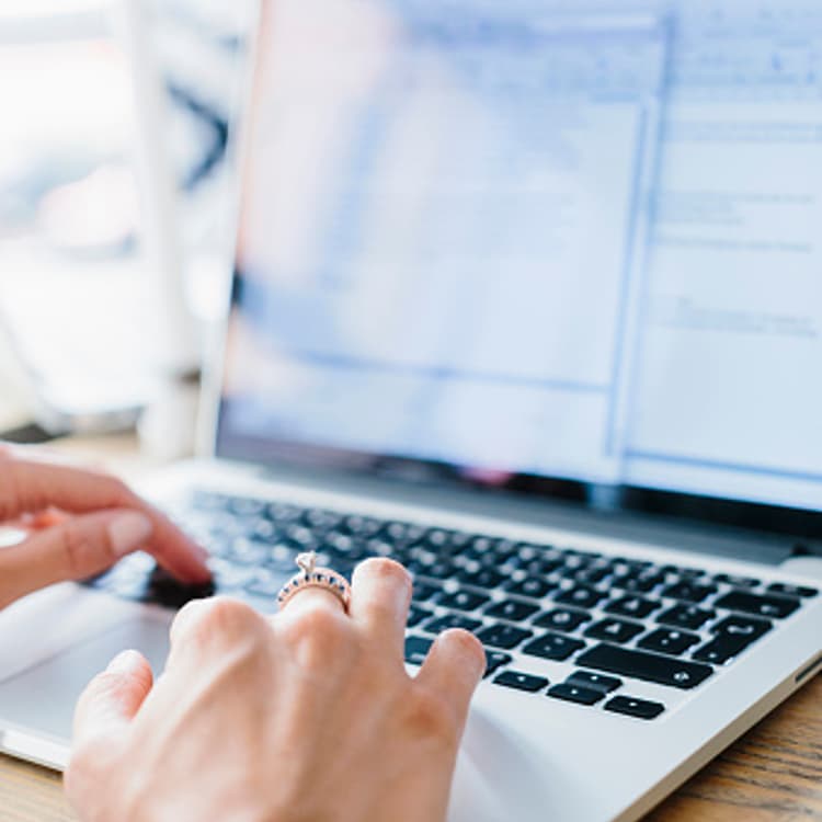 woman-hands-laptop-typing