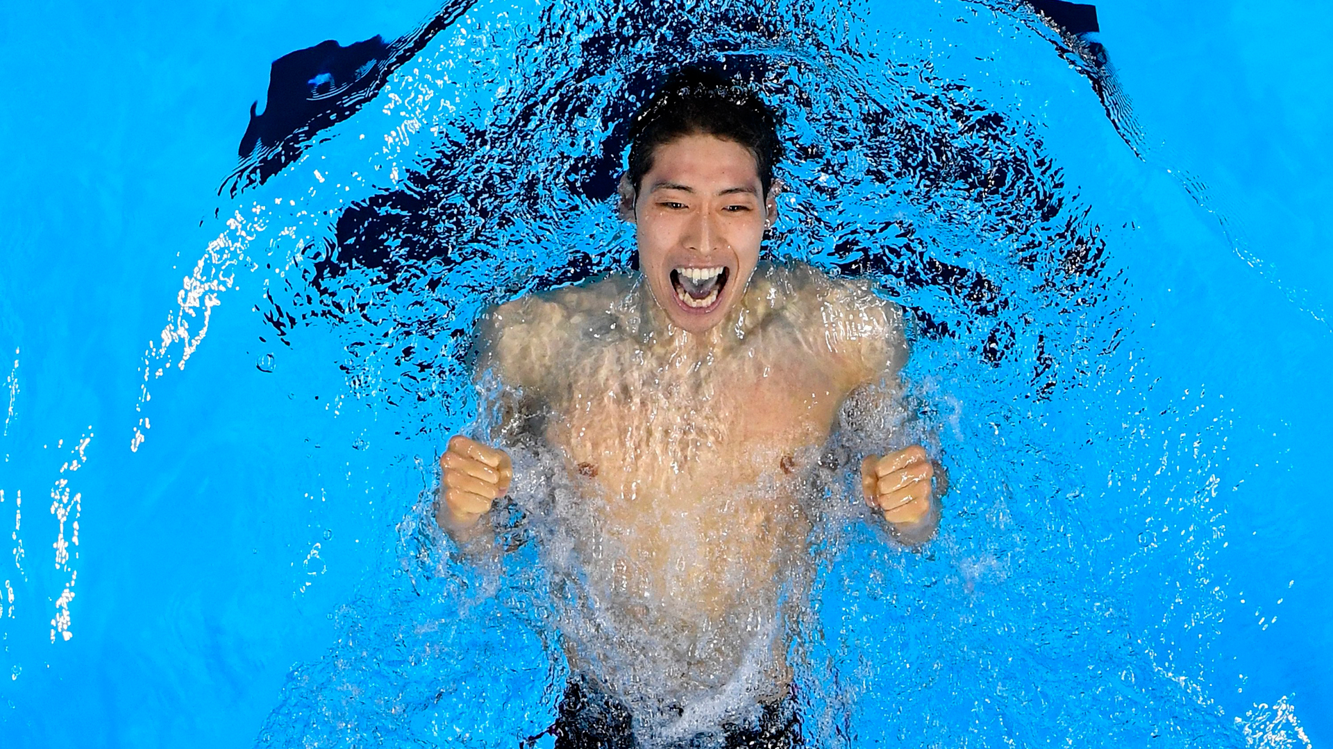 Kosuke Hagino of Japan celebrates winning gold in the final of the Men's 400-meter individual medley on Day 1 of the Summer Olympics at the Olympic Aquatics Stadium in Rio de Janeiro, Brazil, on Aug. 6, 2016.