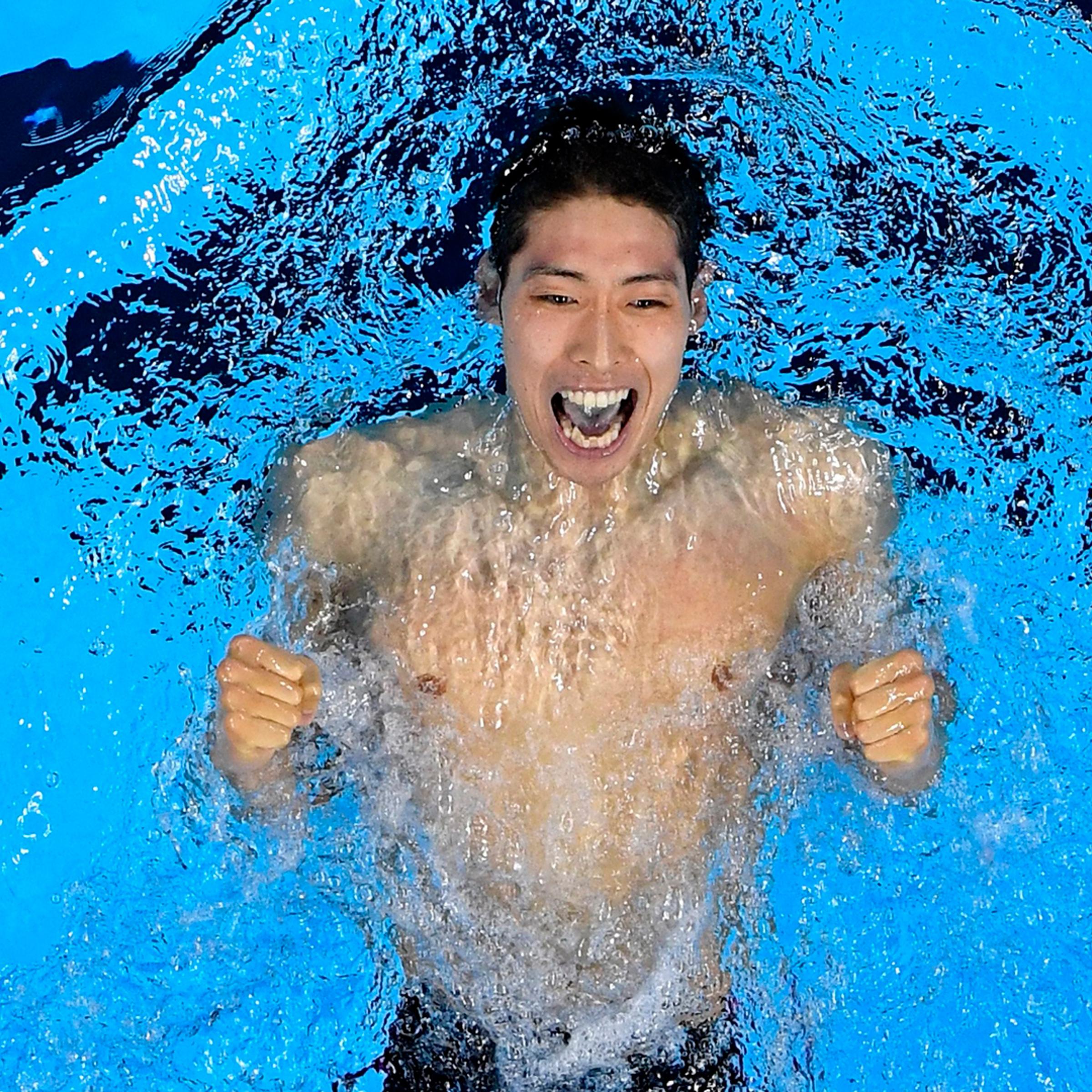 Kosuke Hagino of Japan celebrates winning gold in the final of the Men's 400-meter individual medley on Day 1 of the Summer Olympics at the Olympic Aquatics Stadium in Rio de Janeiro, Brazil, on Aug. 6, 2016.
