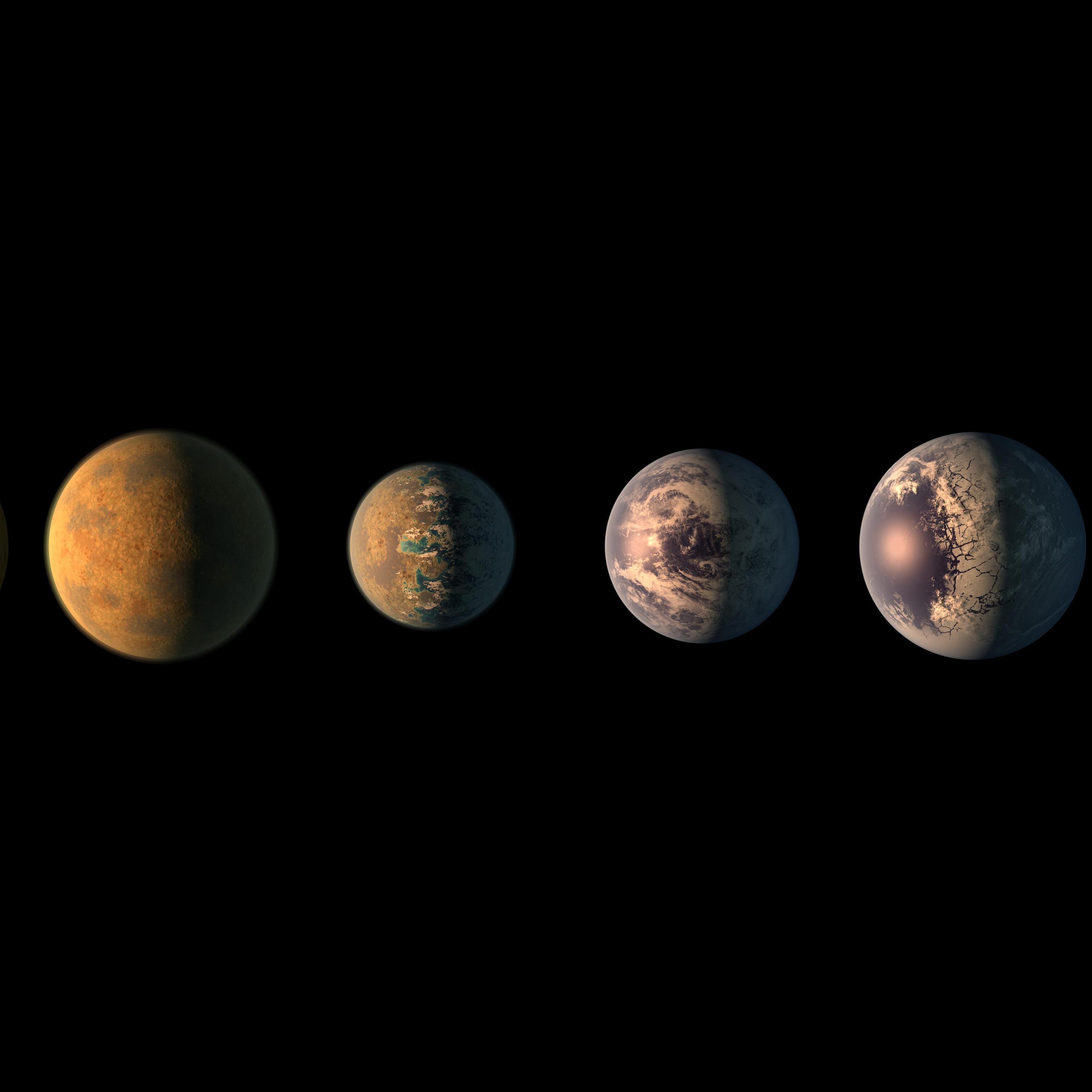 This artist's concept shows what the TRAPPIST-1 planetary system may look like, based on available data about the planets' diameters, masses and distances from the host star.