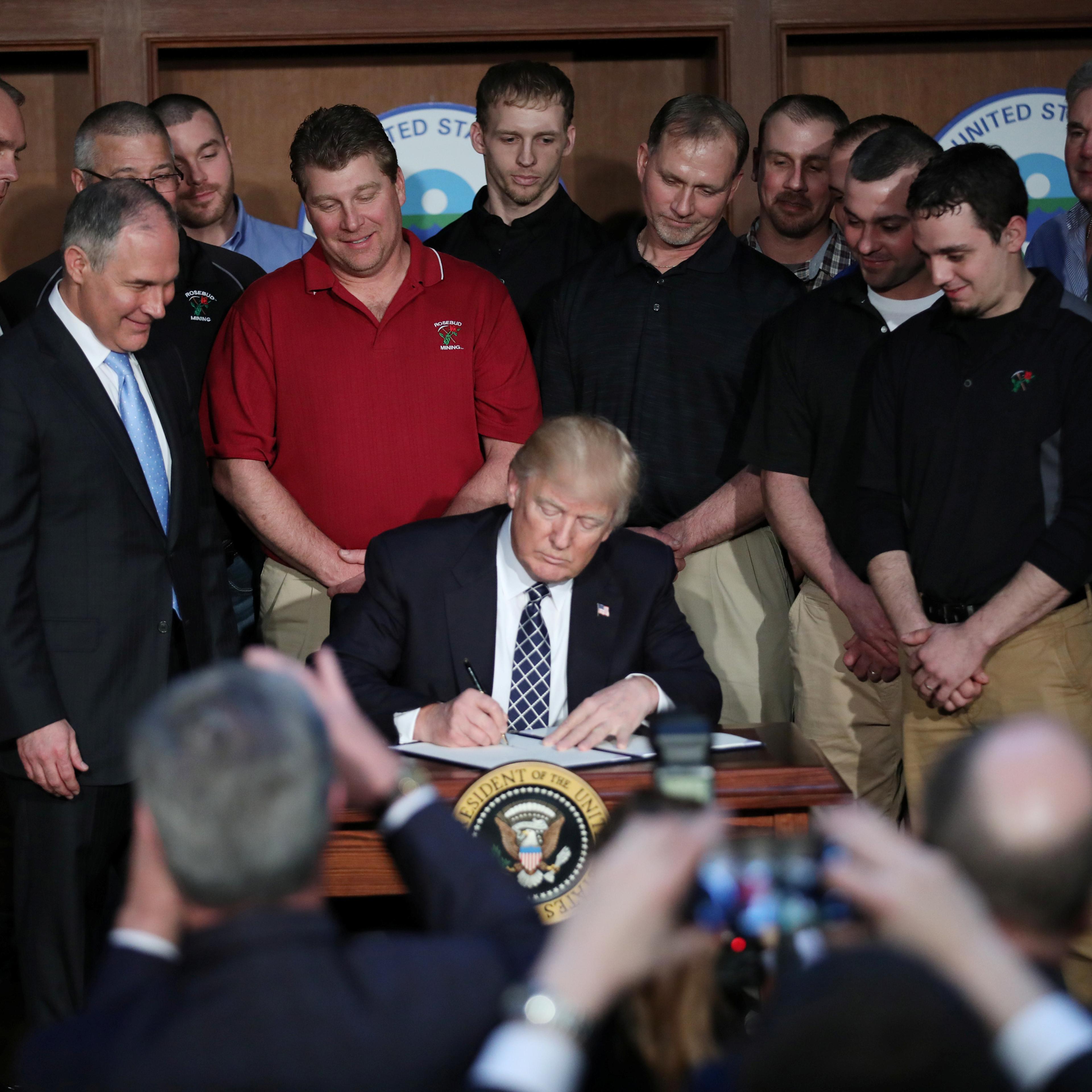 U.S. President Trump signs an executive order on "energy independence" during event at EPA headquarters in Washington