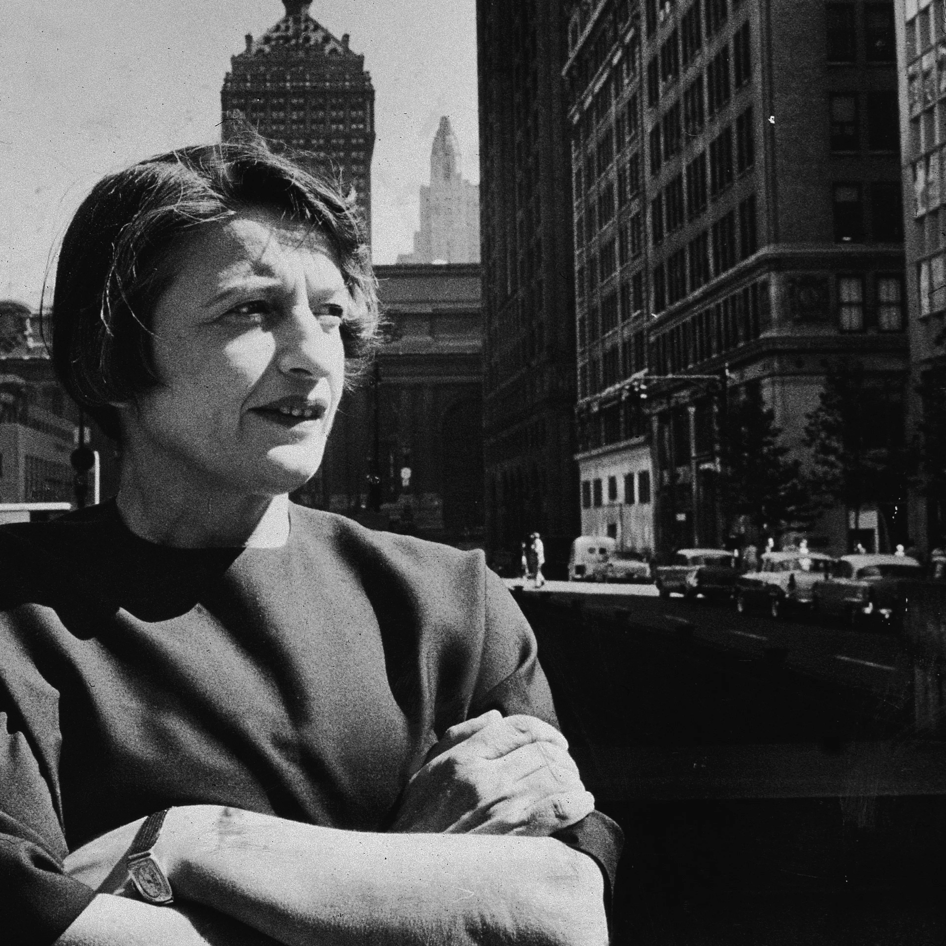 Russian-born author and philosopher Ayn Rand (1905 - 1982) stands with her arms folded on a street in New York City in 1957.