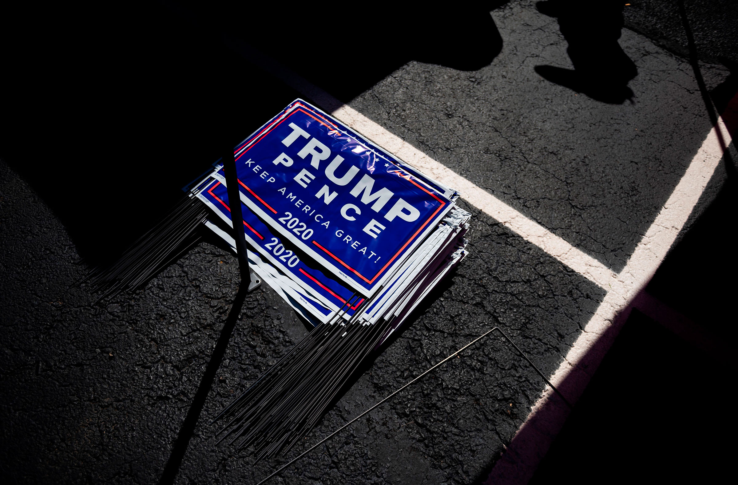 Yard signs for President Donald Trump are seen during a Republican voter registration in Brownsville