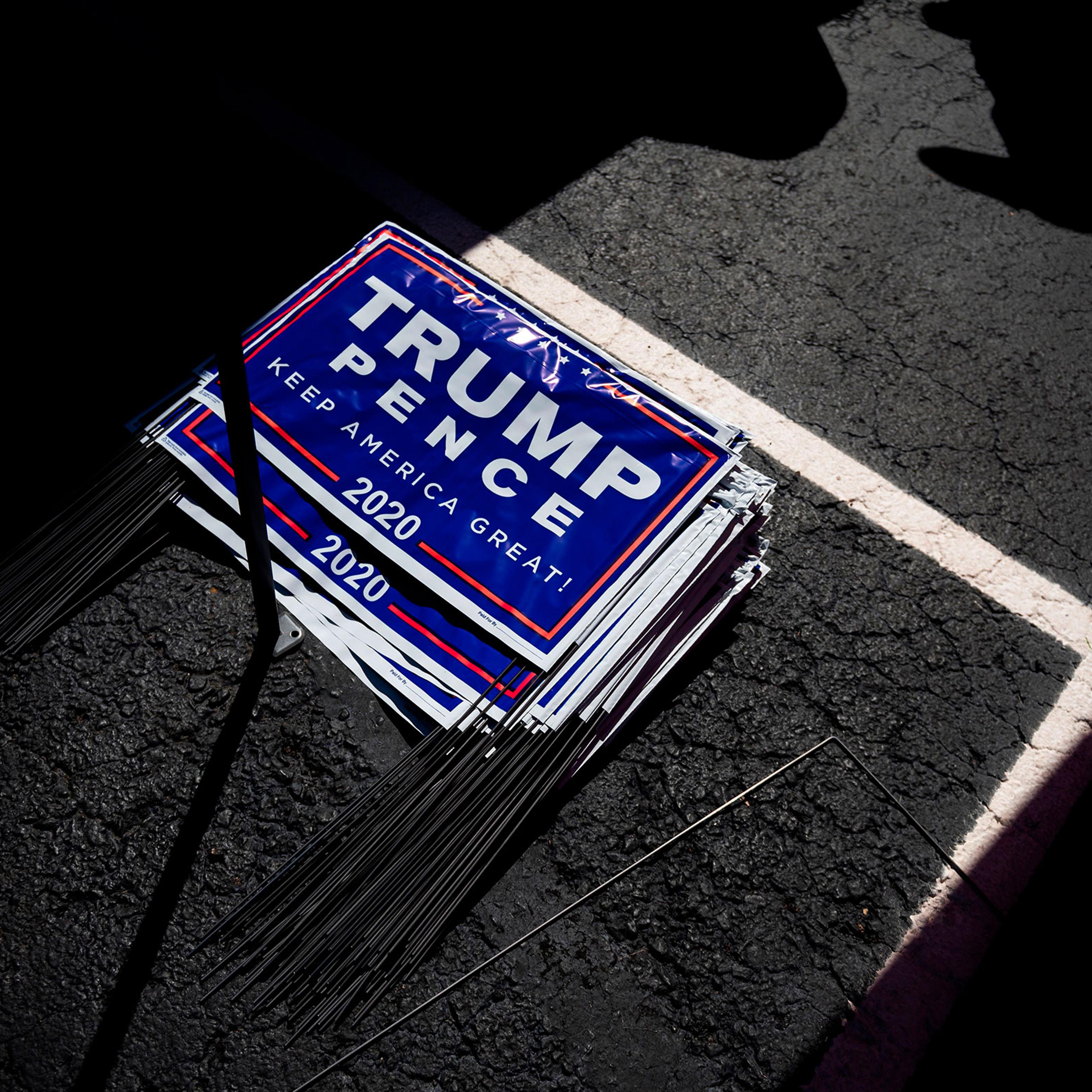 Yard signs for President Donald Trump are seen during a Republican voter registration in Brownsville