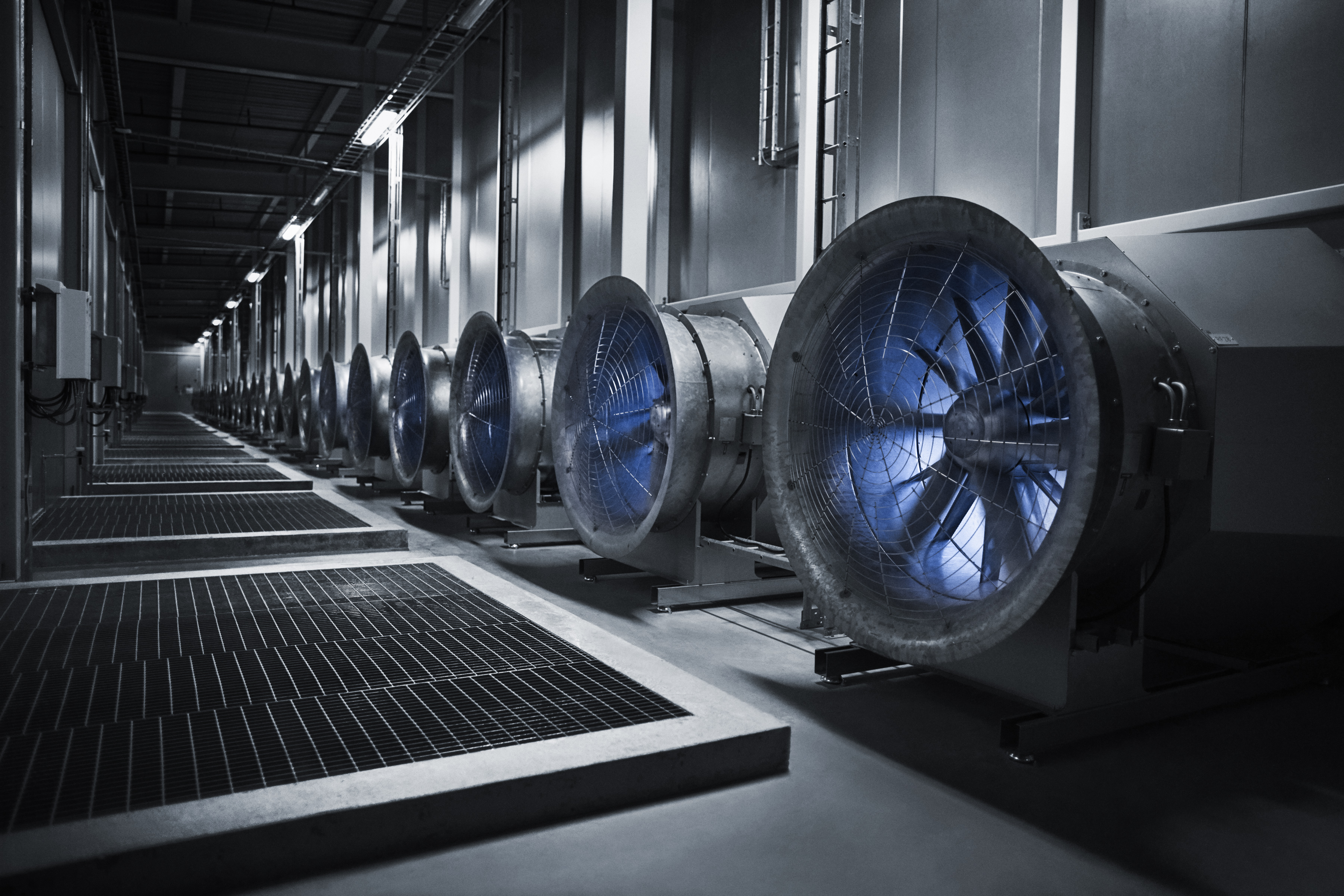 These enormous fans draw in the outside air to cool the servers in the data hall. In the winter, when temperatures plunge to -30 degrees the situation is reversed, and the heat from the servers warm the massive buildings.