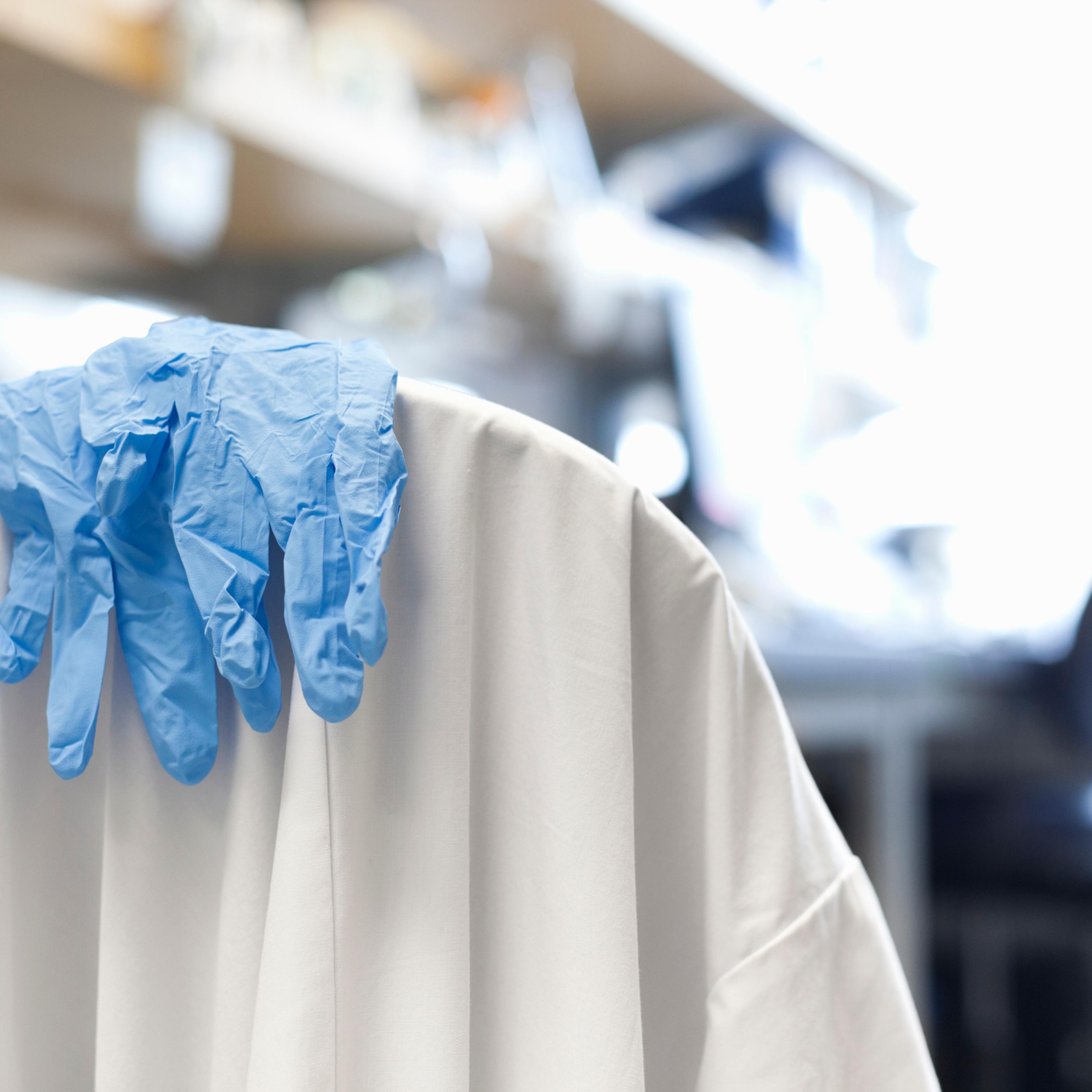 Scientist's gloves and lab coat