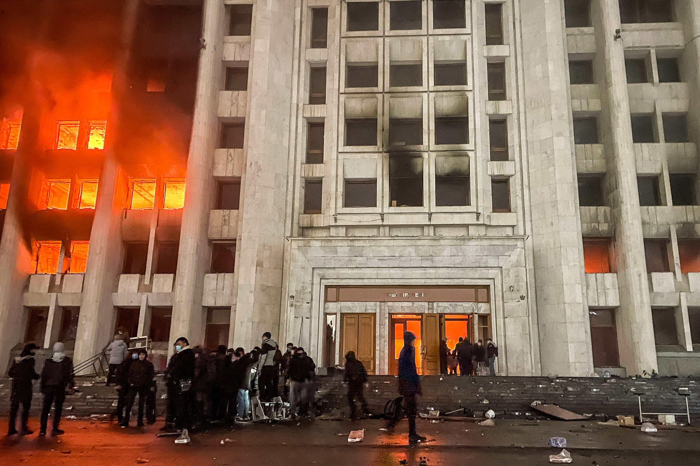 People protest outside the mayor's office in Almaty, Kazakhstan on Jan. 5, 2022. Protestors broke into the mayor's office and set it on fire.