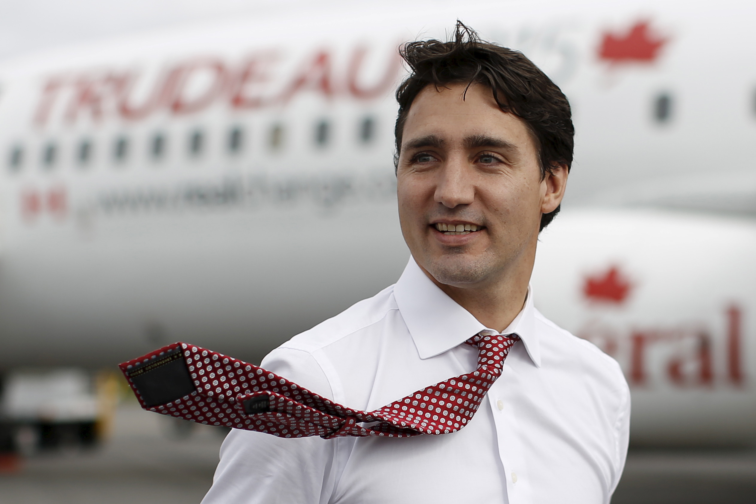 Liberal leader Trudeau walks on the tarmac after arriving in Saint John