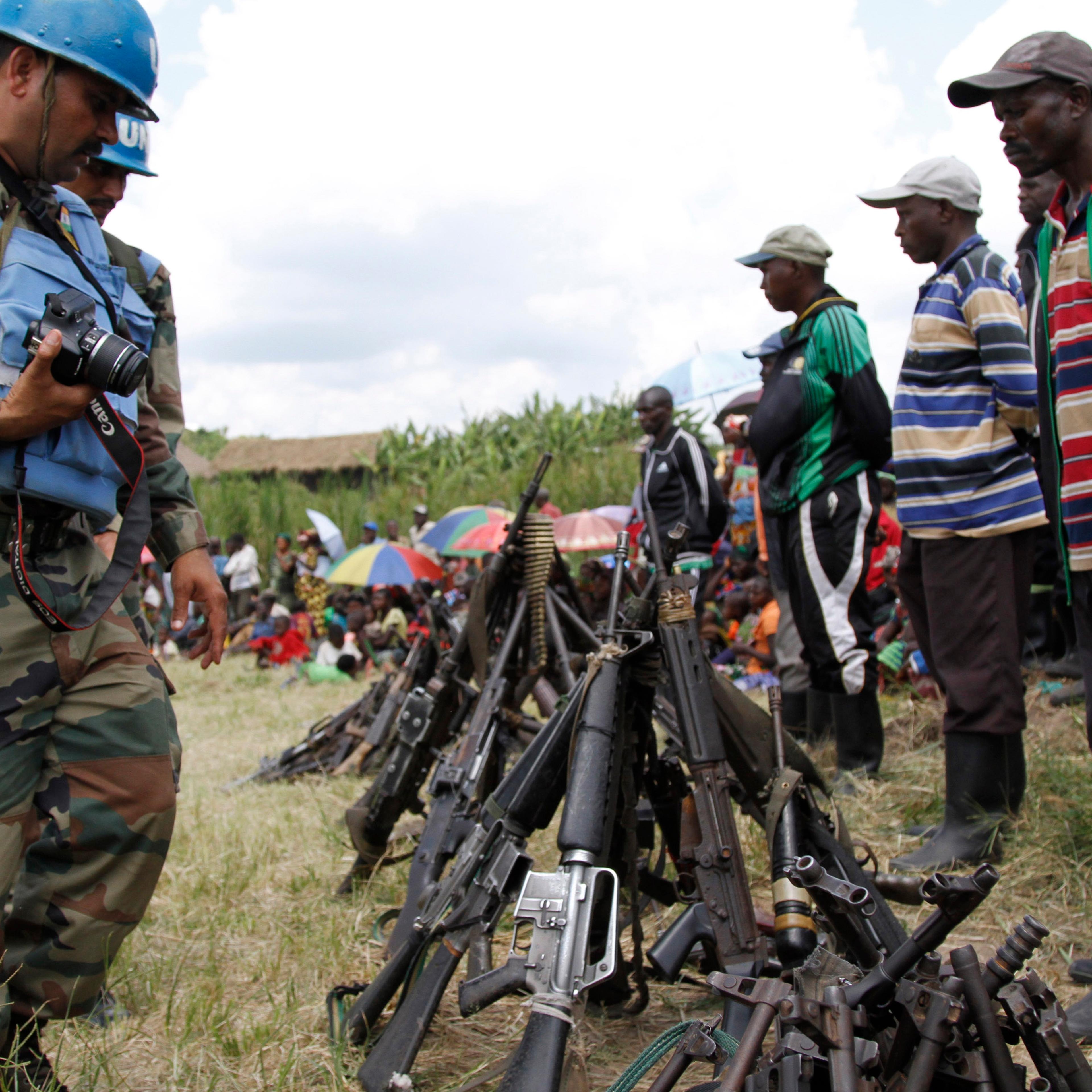 United Nations peace keepers record details of weapons recovered from the Democratic Forces for the Liberation of Rwanda (FDLR) militants after their surrender in Kateku