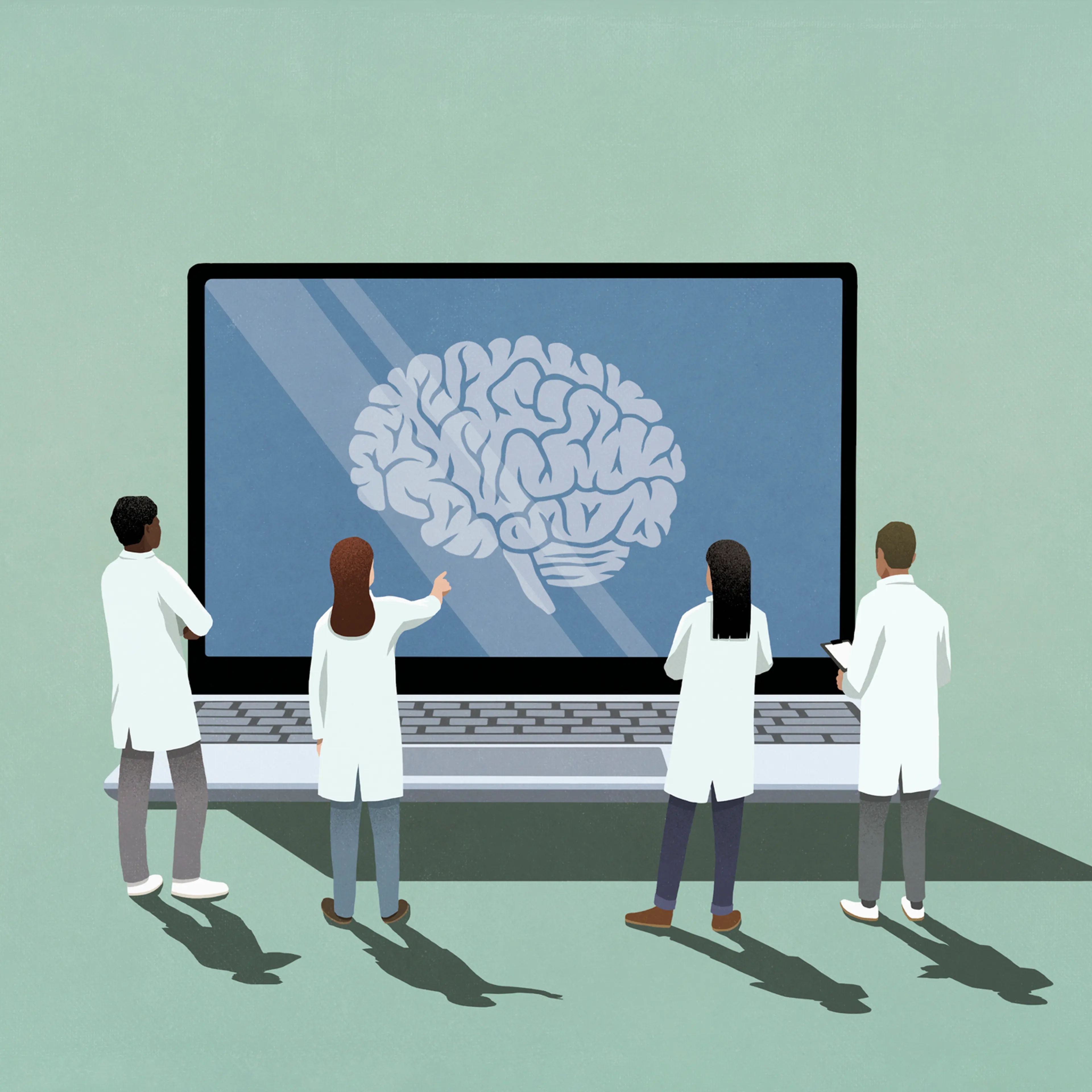 Neuroscientists looking at brain image on laptop screen