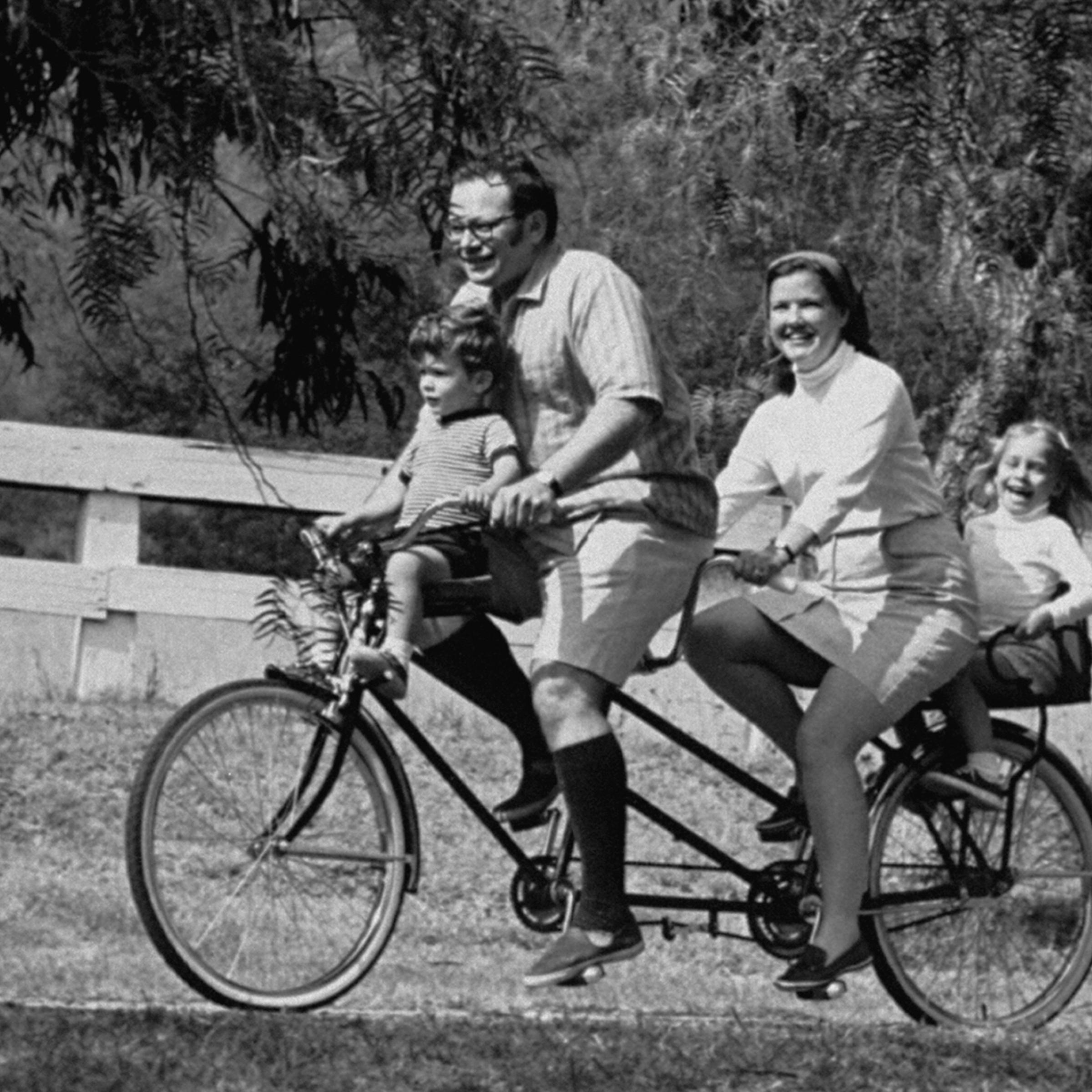 Nancy Lincoln, leukemia patient, with husband and two children, rides a bicycle-built-for-two in a California park, 1970.