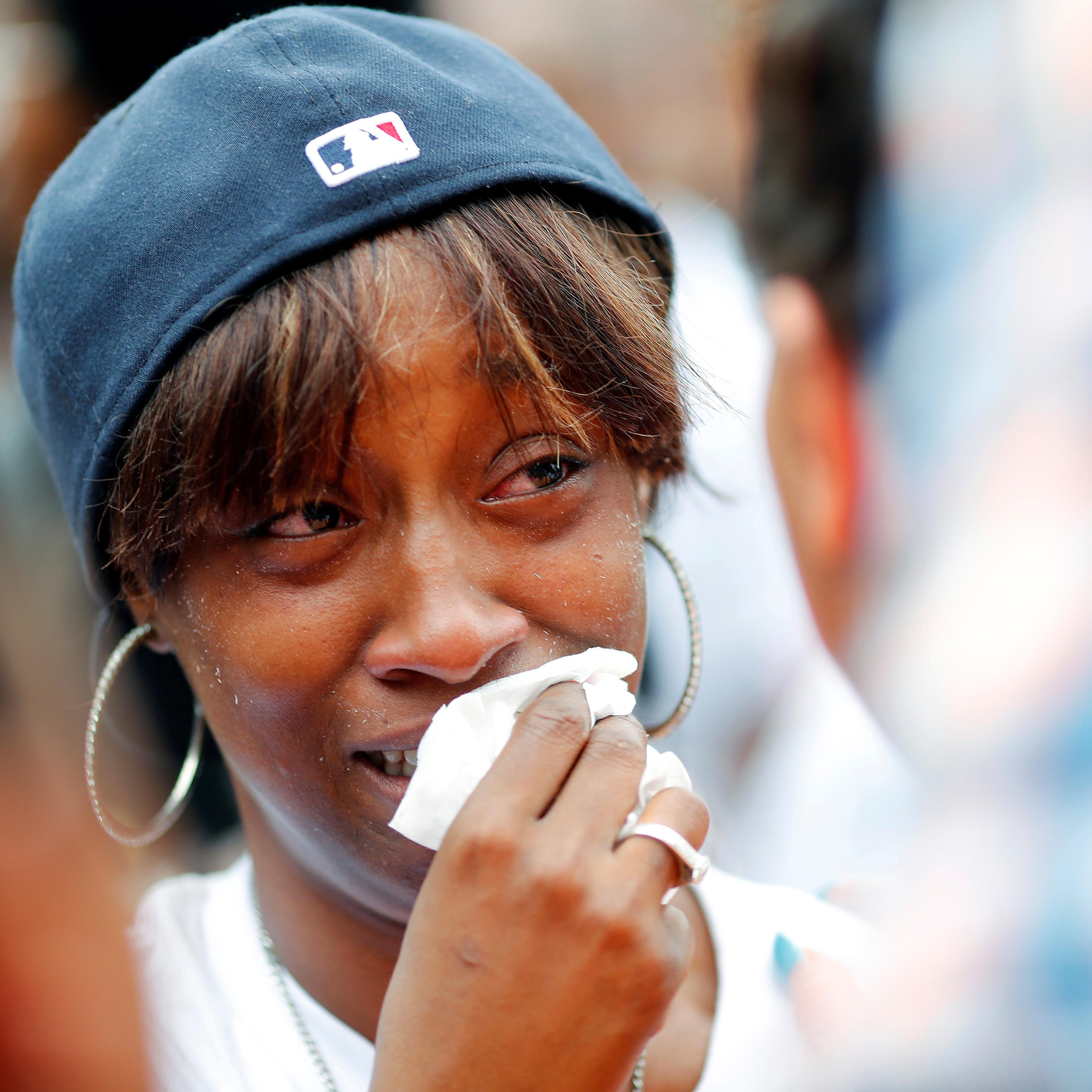 Diamond Reynolds, girlfriend of Philando Castile gets a hug as people gather to protest the fatal shooting of Philando Castile by Minneapolis area police in St. Paul