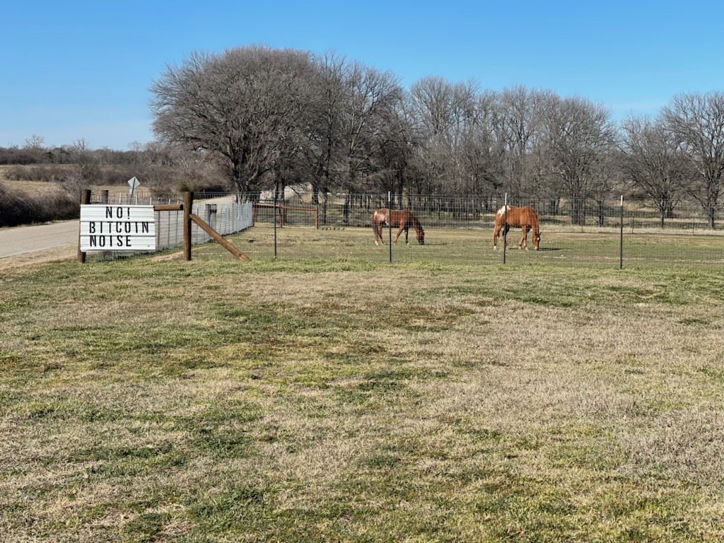 Cheryl Shadden, a resident of Granbury, hung a sign on her street to protest the noise from a nearby bitcoin facility.