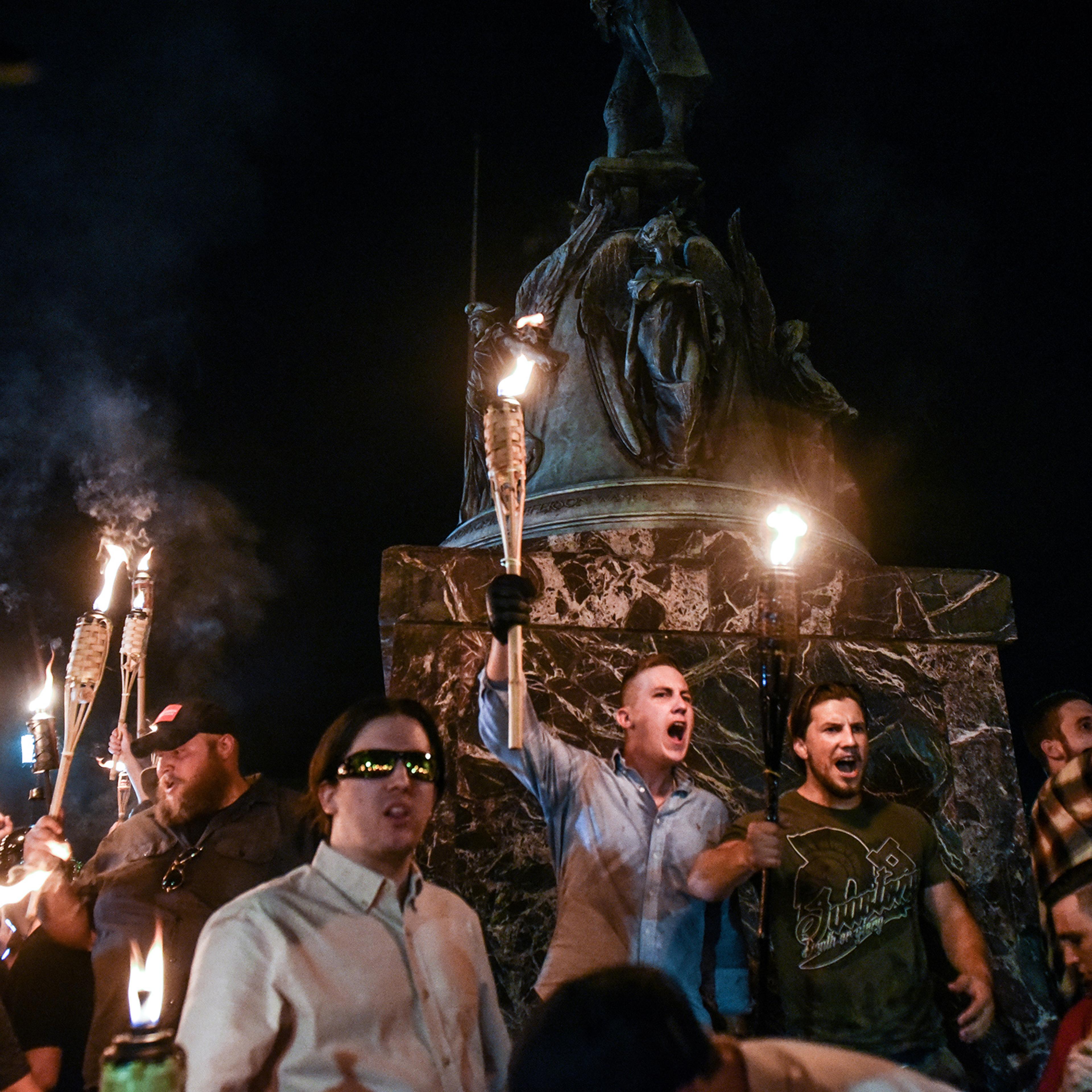 White nationalists participate in a torch-lit march on the grounds of the University of Virginia ahead of the Unite the Right Rally in Charlottesville, Aug. 11, 2017.