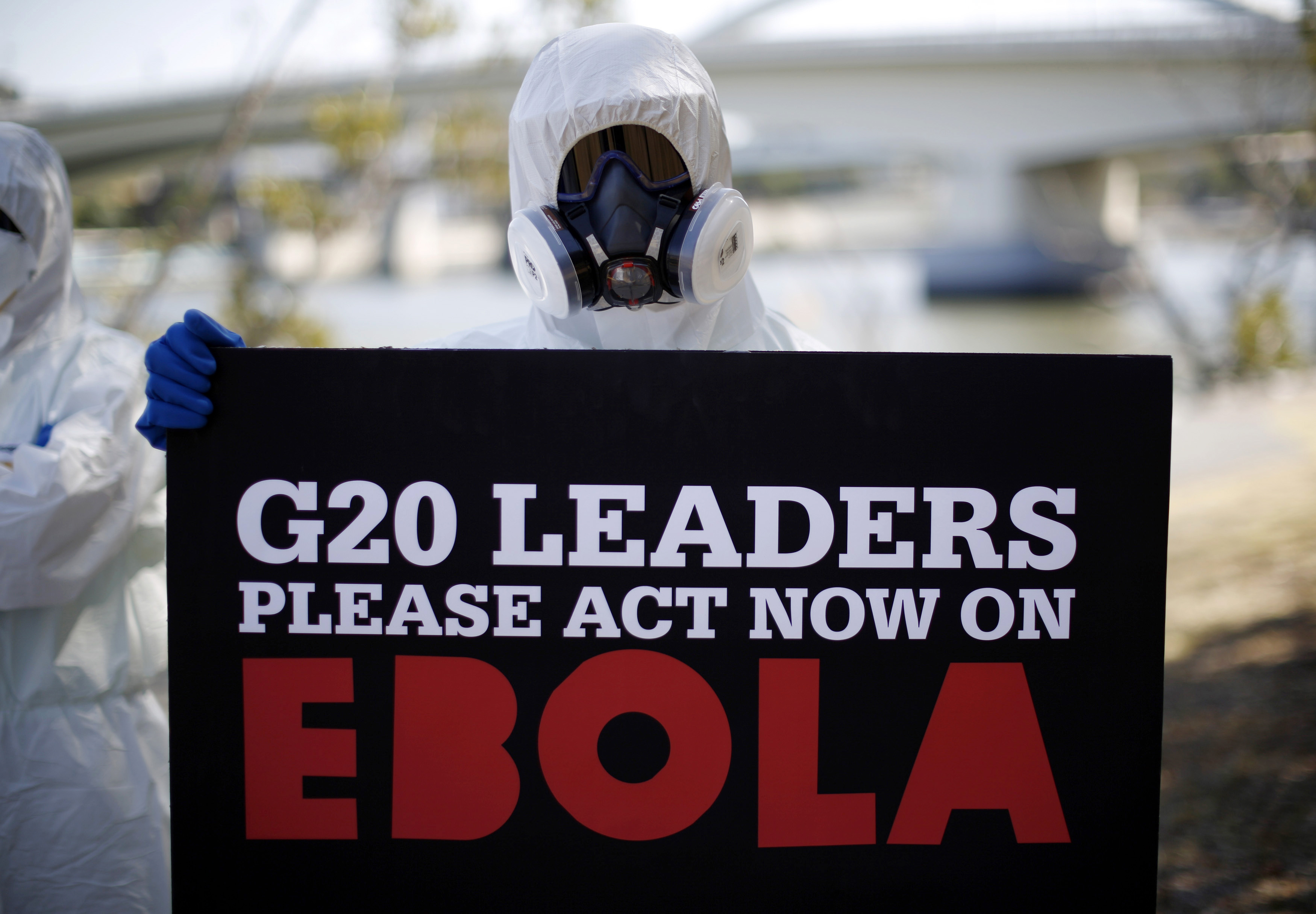 A protester dressed in protective equipment demonstrates in Brisbane