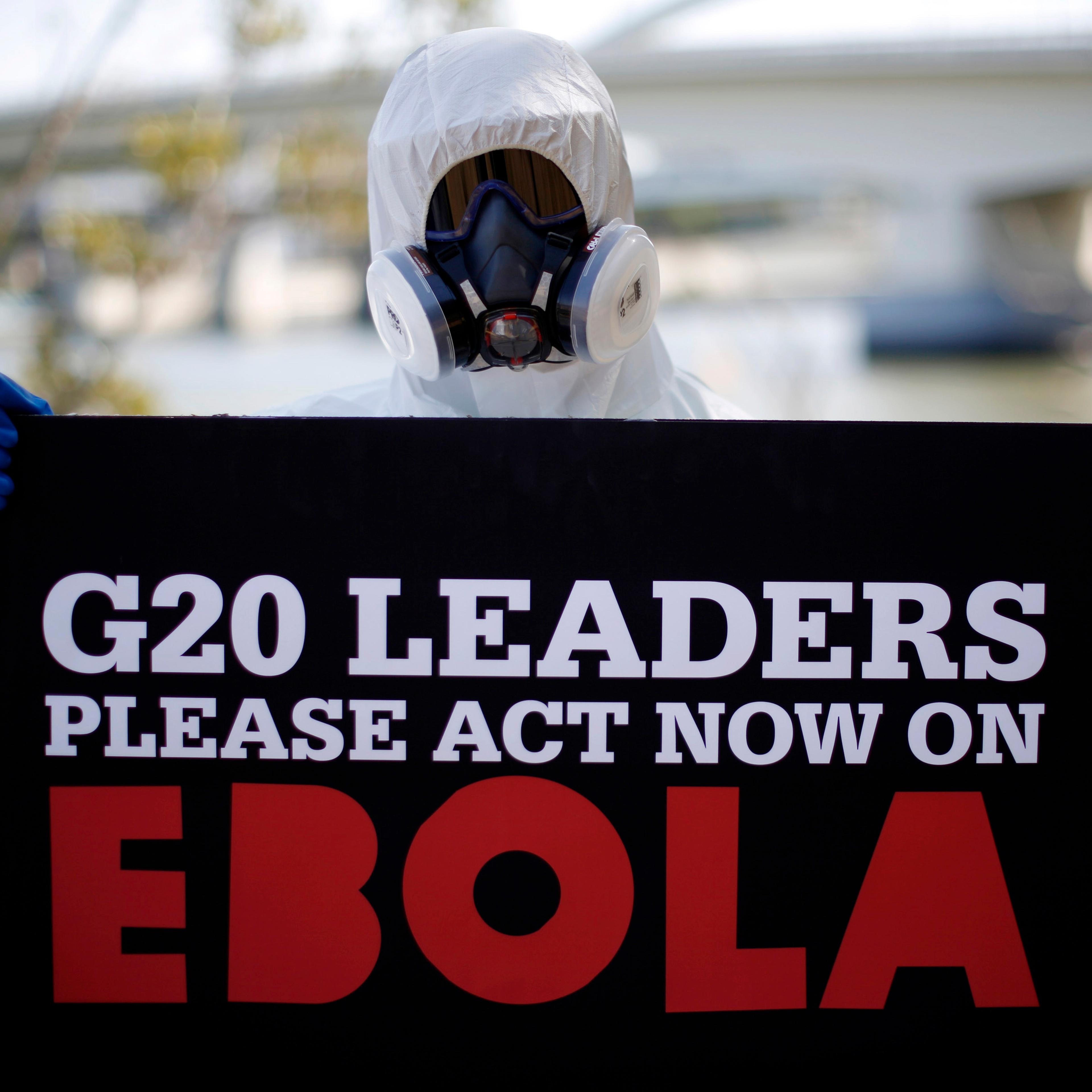 A protester dressed in protective equipment demonstrates in Brisbane