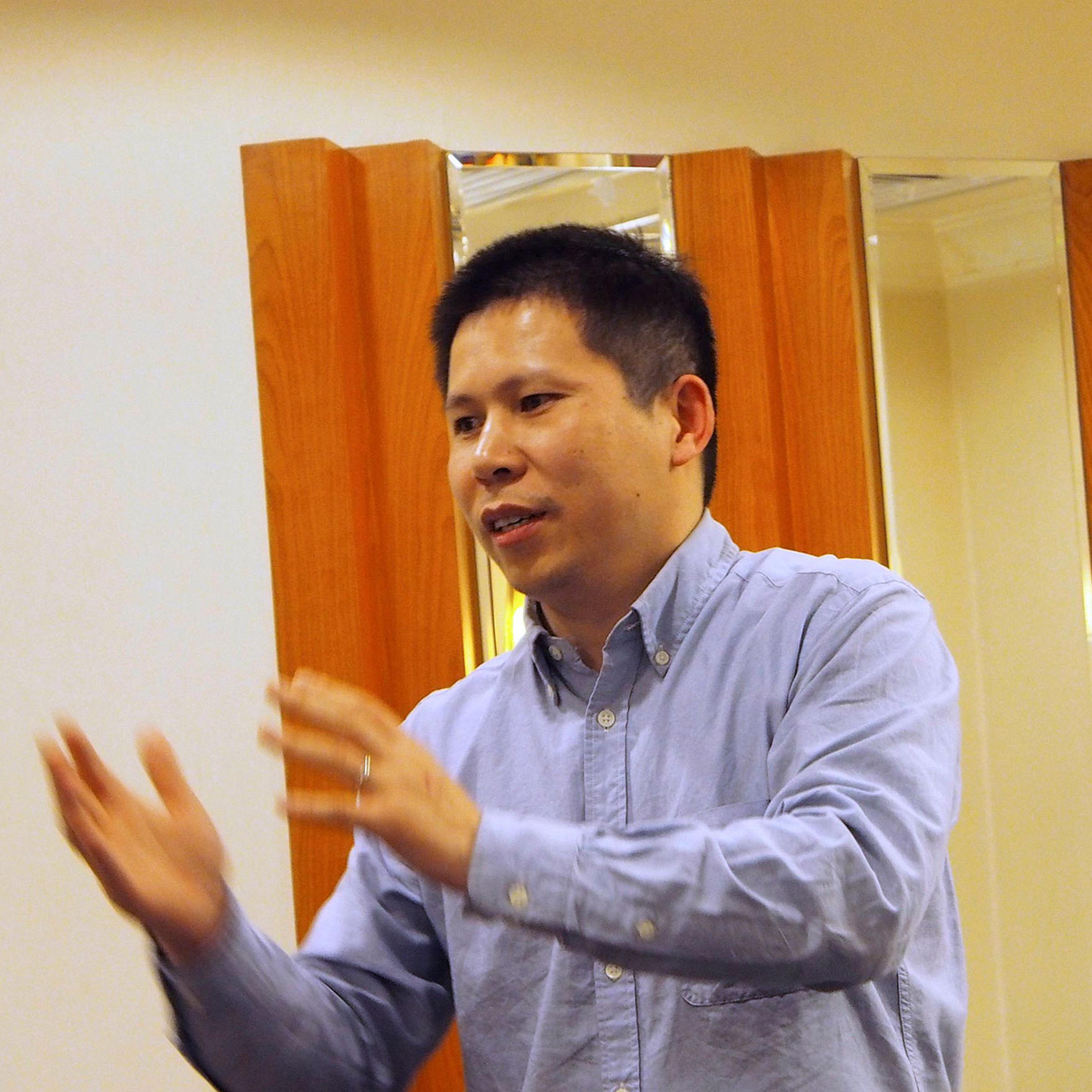 Chinese rights advocate Xu Zhiyong speaks during a meeting in Beijing in this handout photo dated March 30, 2013