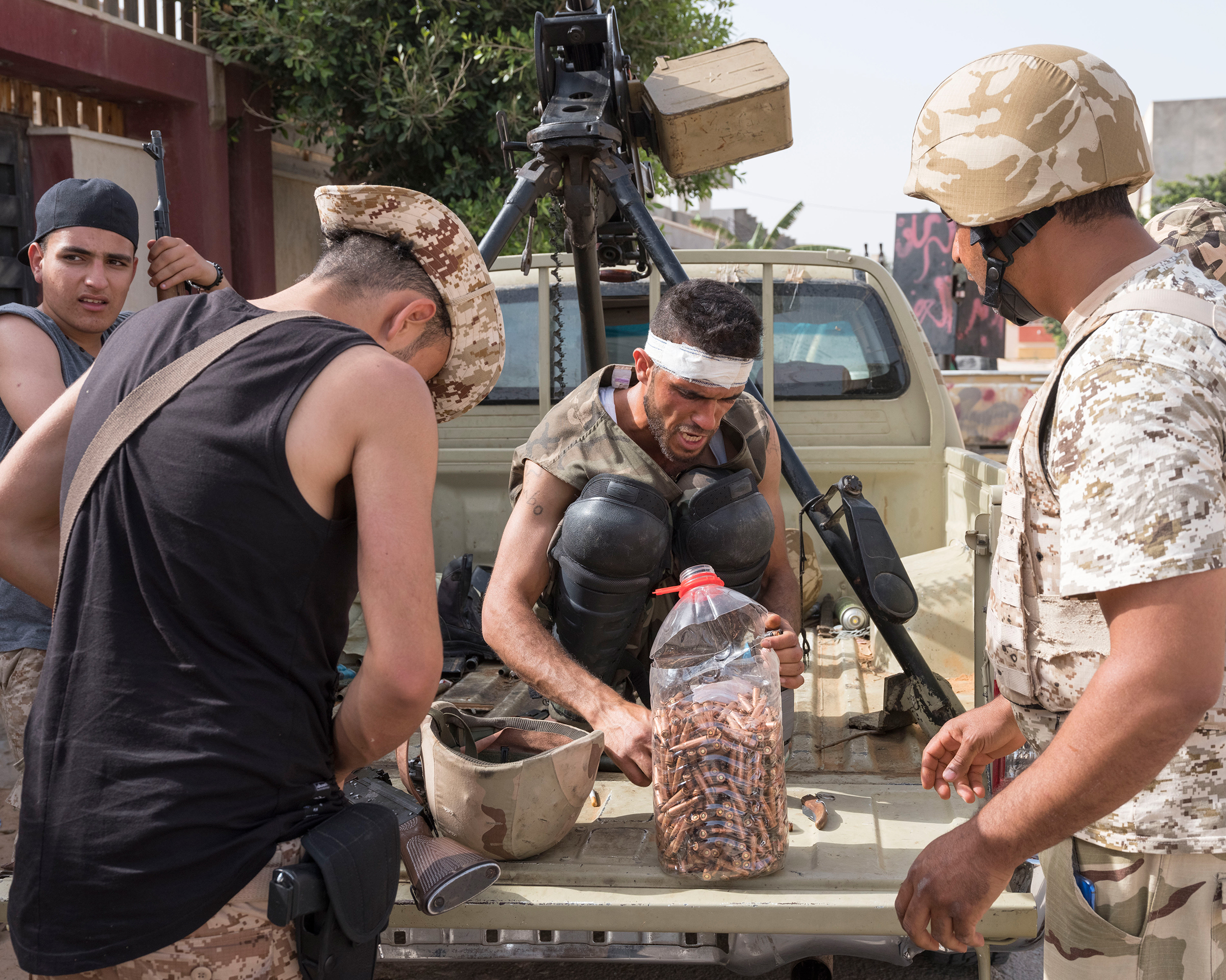 Forces allied with the U.N.-backed government reload ammo on the frontline outside Tripoli in April 2019.