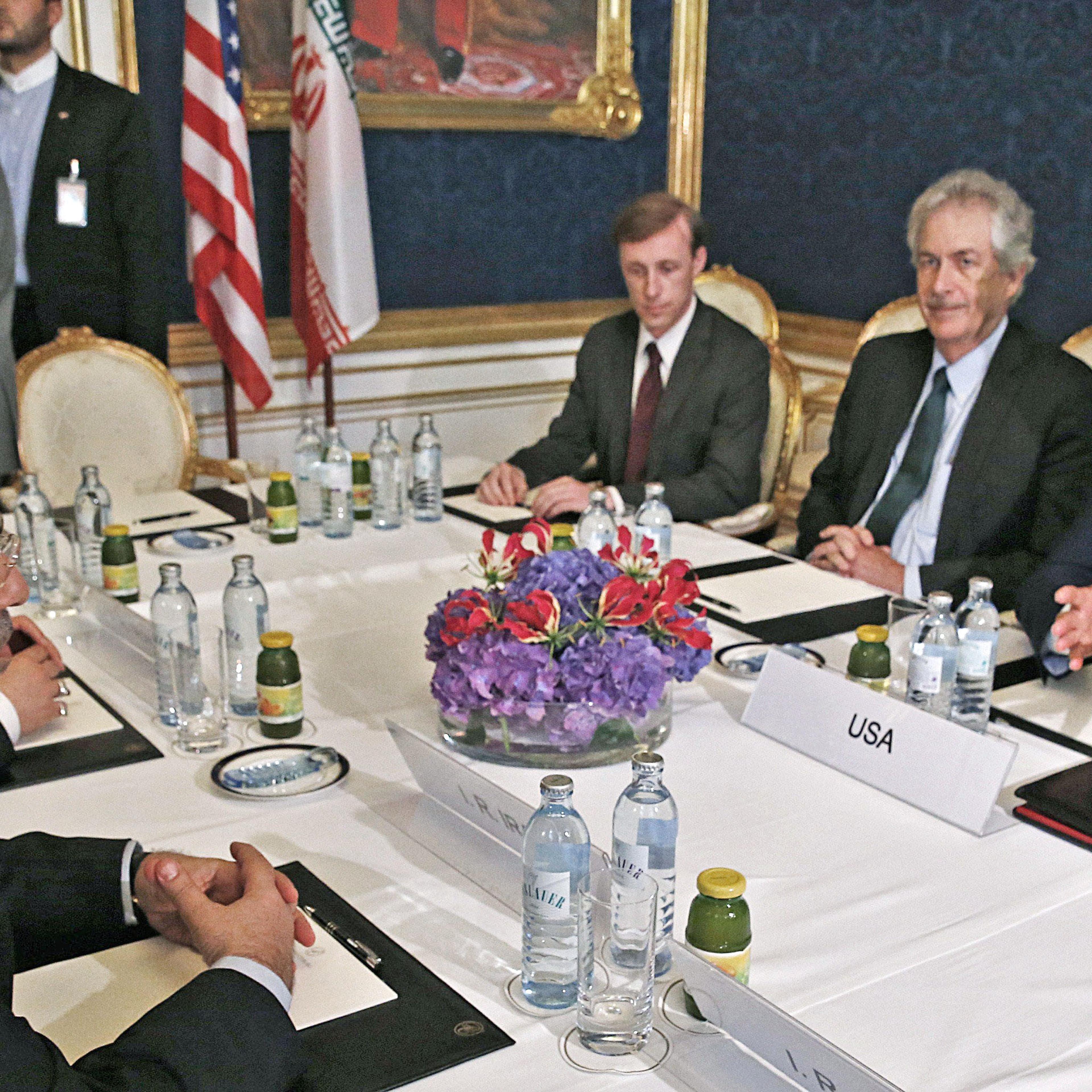 From left: Iran's Foreign Minister Mohammad Javad Zarif meets with U.S. Secretary of State John Kerry during talks between the foreign ministers of the six powers negotiating with Tehran on its nuclear program, in Vienna, on July 13, 2014.