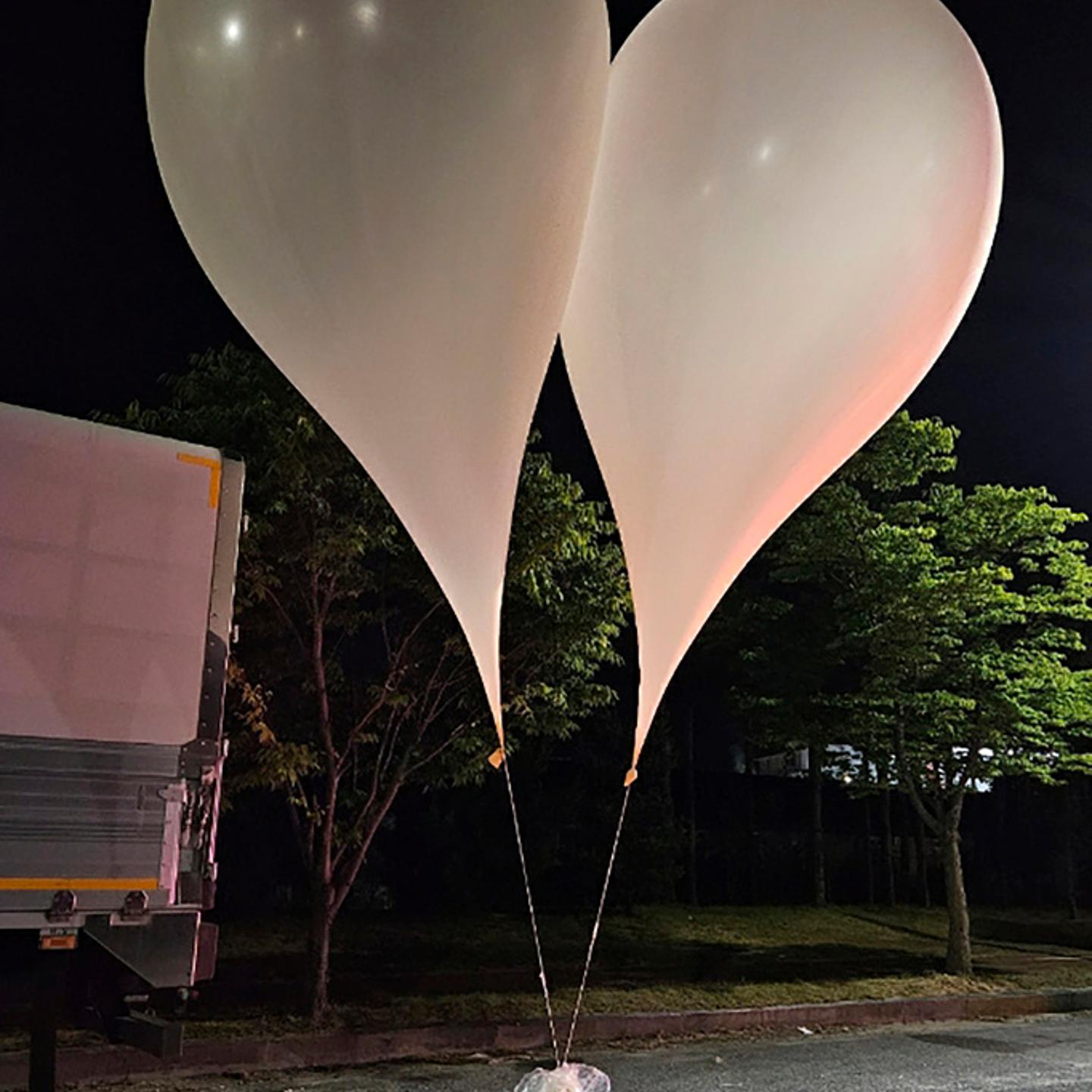 This photo provided by South Korea Defense Ministry, shows balloons with trash presumably sent by North Korea, in South Chungcheong Province, South Korea, Wednesday, May 29, 2024.