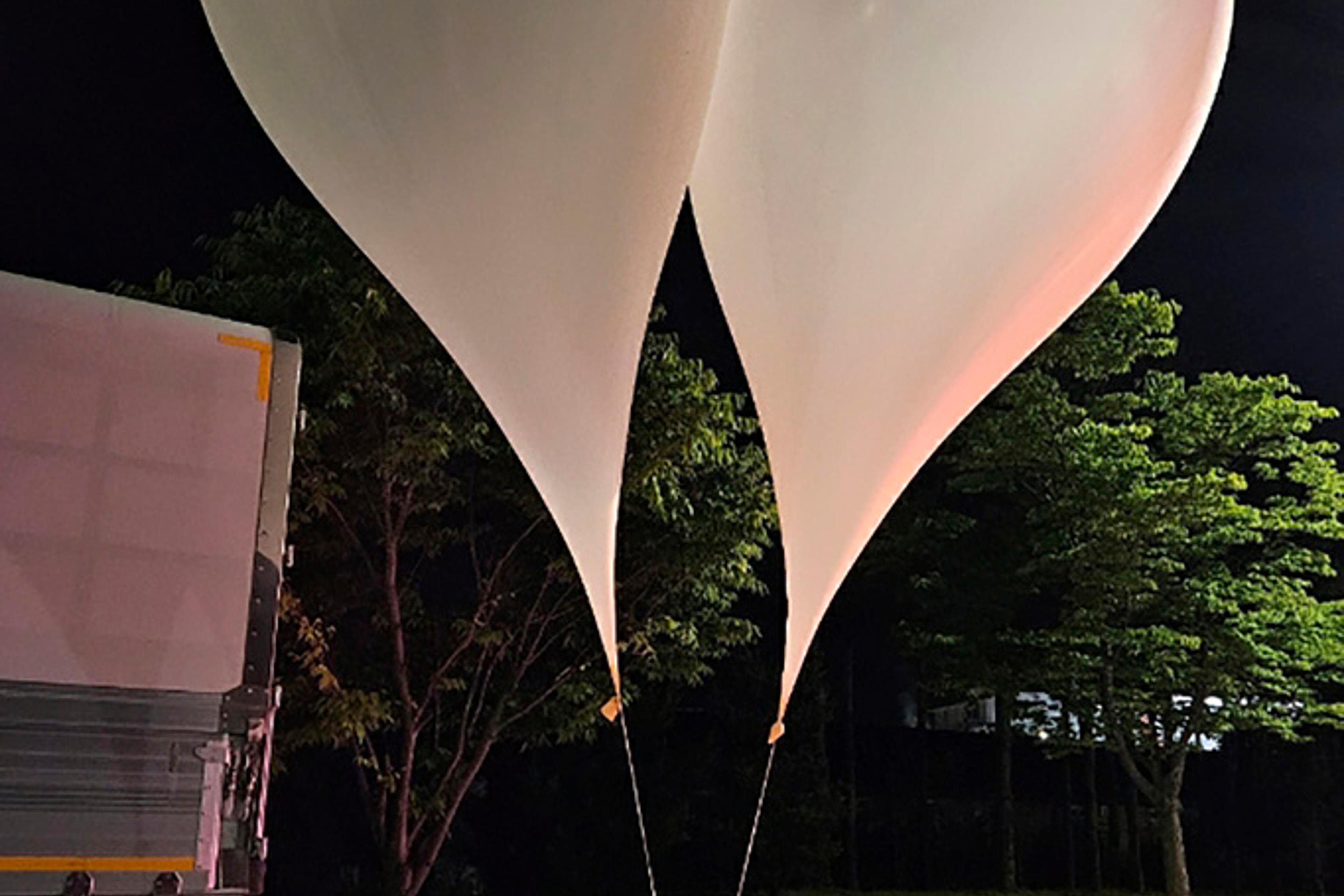This photo provided by South Korea Defense Ministry, shows balloons with trash presumably sent by North Korea, in South Chungcheong Province, South Korea, Wednesday, May 29, 2024.