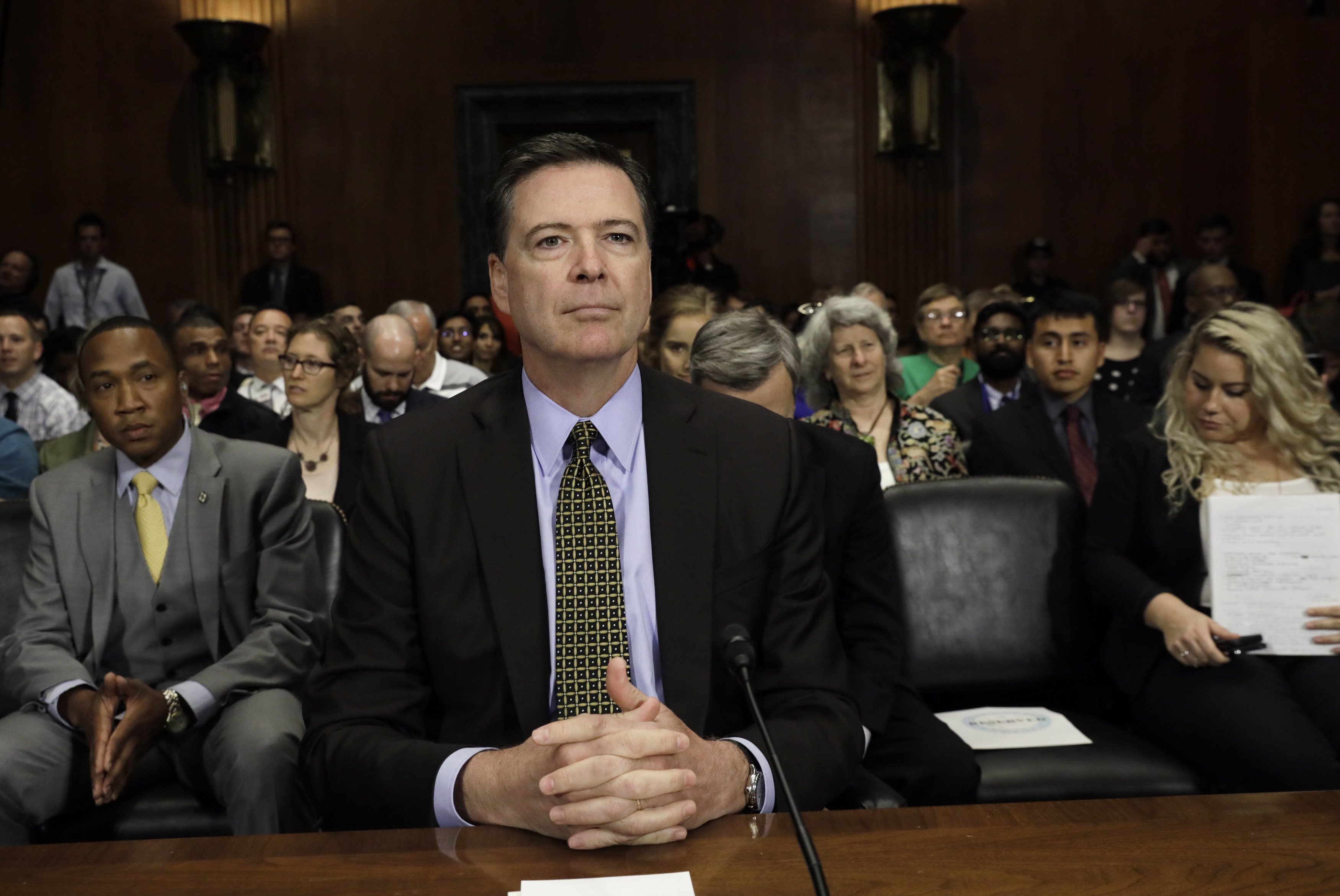FBI Director Comey prepares to testify at a Senate Judiciary Committee hearing on Capitol Hill in Washington