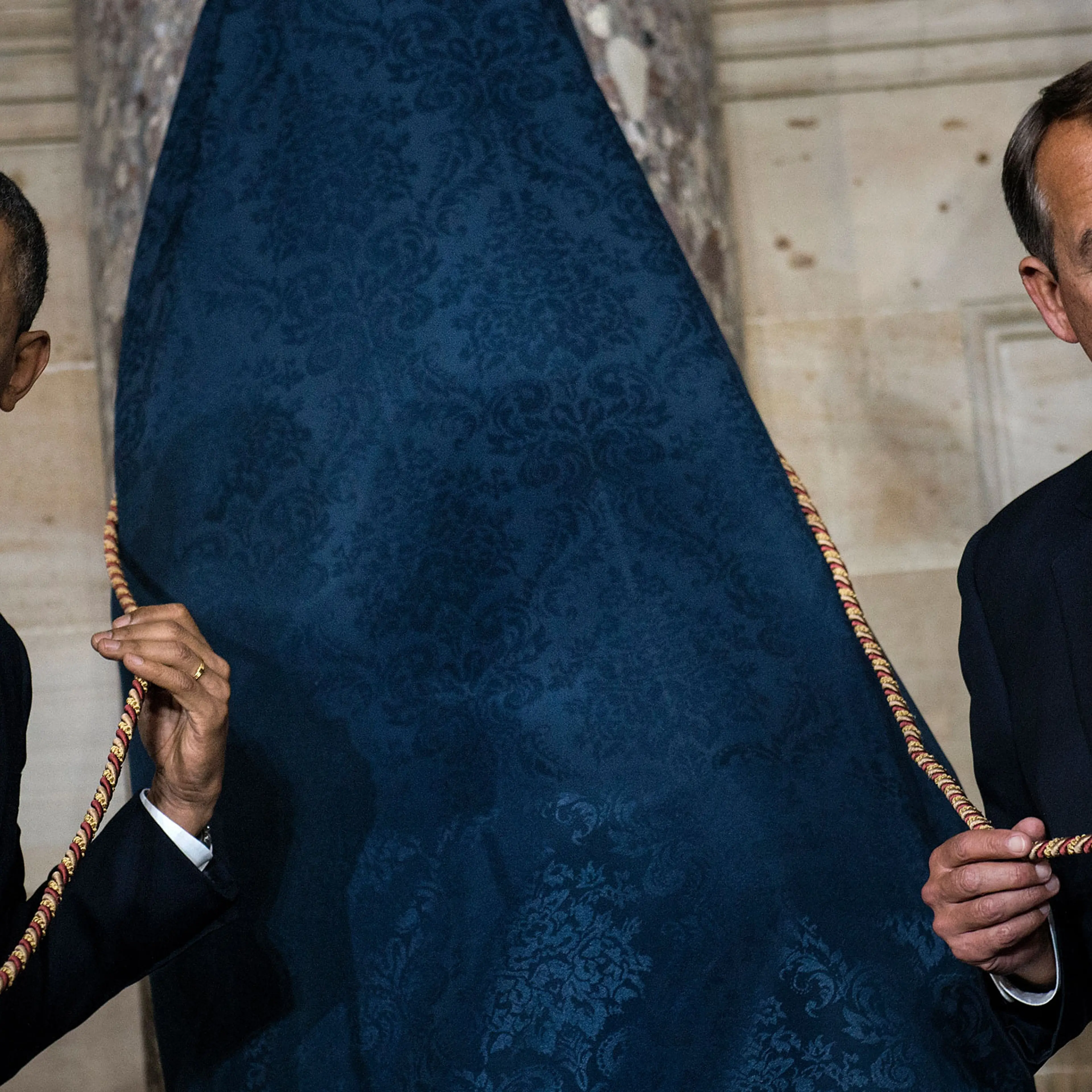 President Barack Obama and Speaker of the House John Boehner wait to unveil a statue of Rosa Parks during an unveiling in Statuary Hall on Capitol Hill in Washington, Feb. 27, 2013.