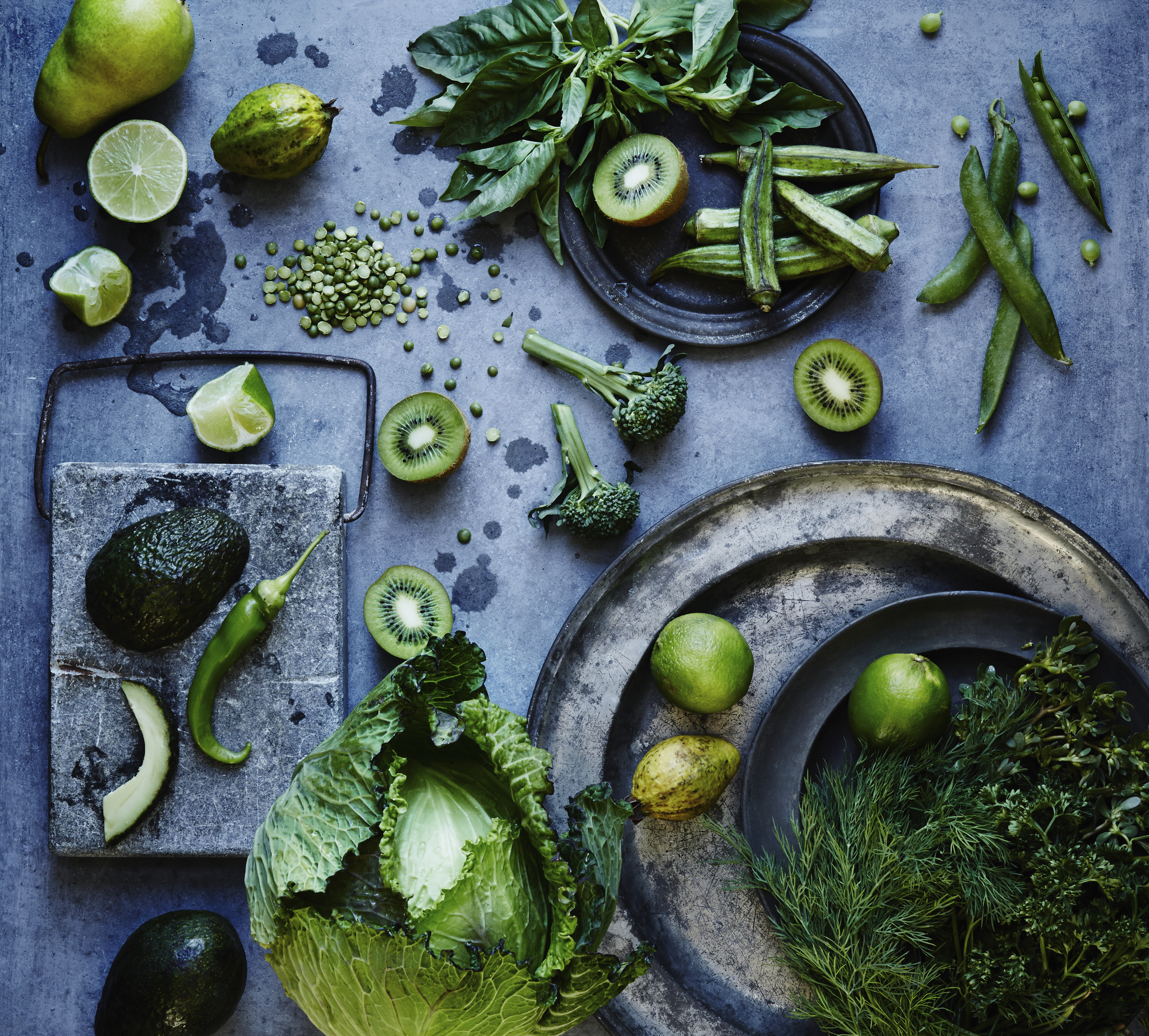 High angle view of green fruits and vegetables on plates