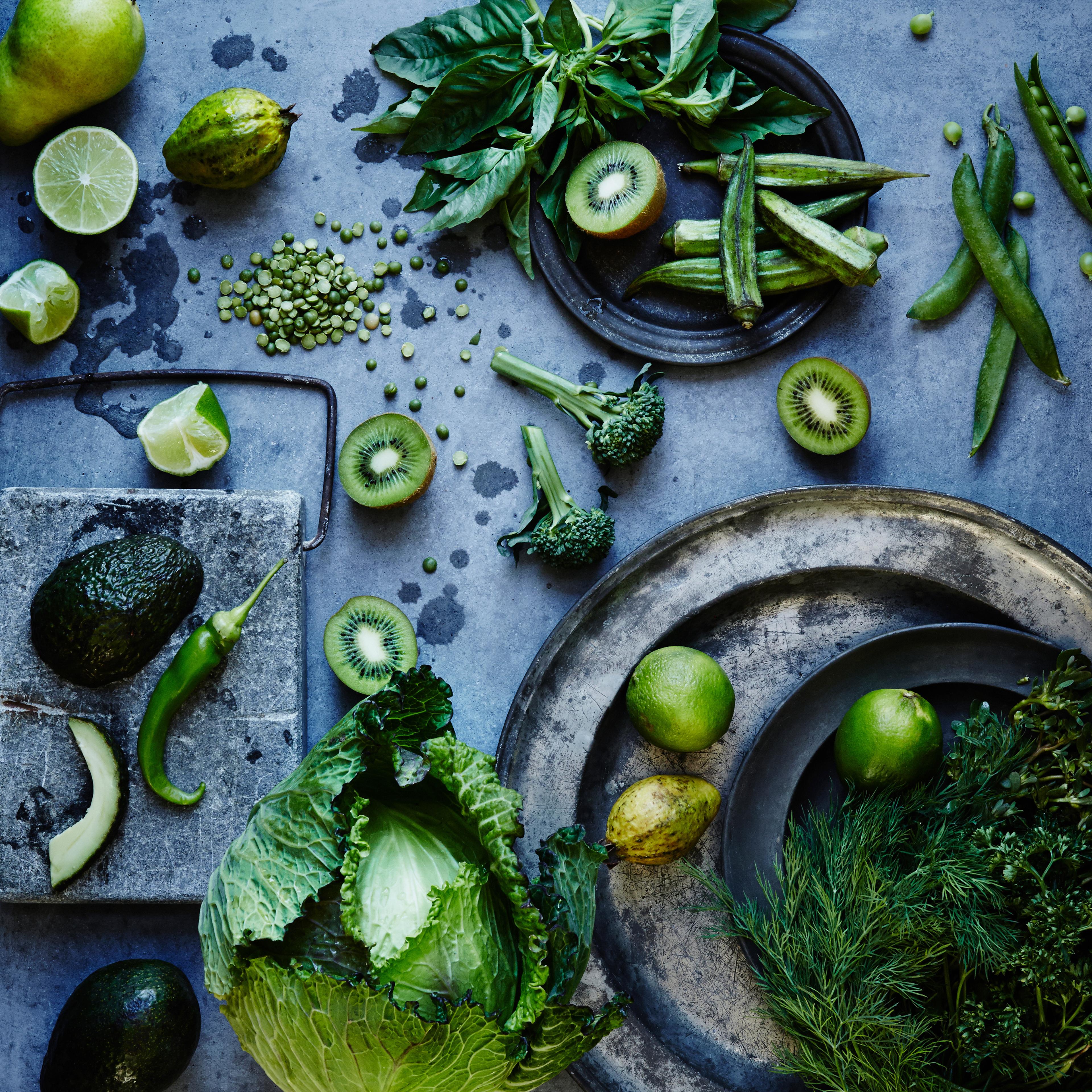 High angle view of green fruits and vegetables on plates