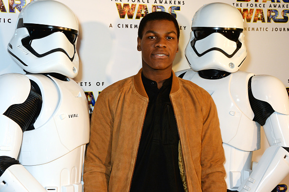 ohn Boyega (C) poses with Stormtroopers at the UK Gala Screening of 'Secrets Of The Force Awakens: A Cinematic Journey' at Picturehouse Central on March 29, 2016 in London, England.