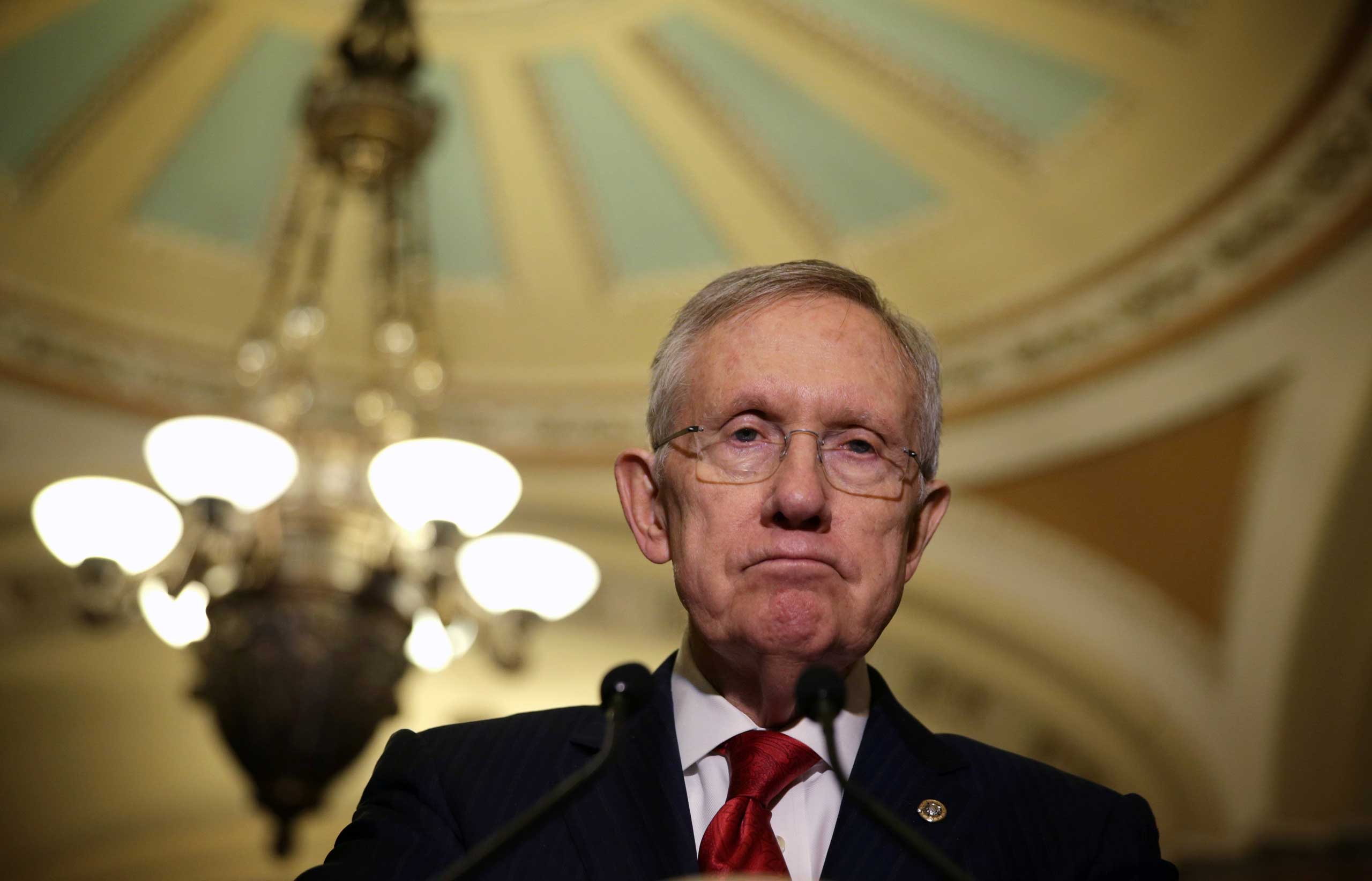 Senate Majority Leader Sen. Harry Reid speaks to members of the media after the Senate Democratic Policy Luncheon at the Capitol Dec. 9, 2014 on Capitol Hill in Washington, DC.