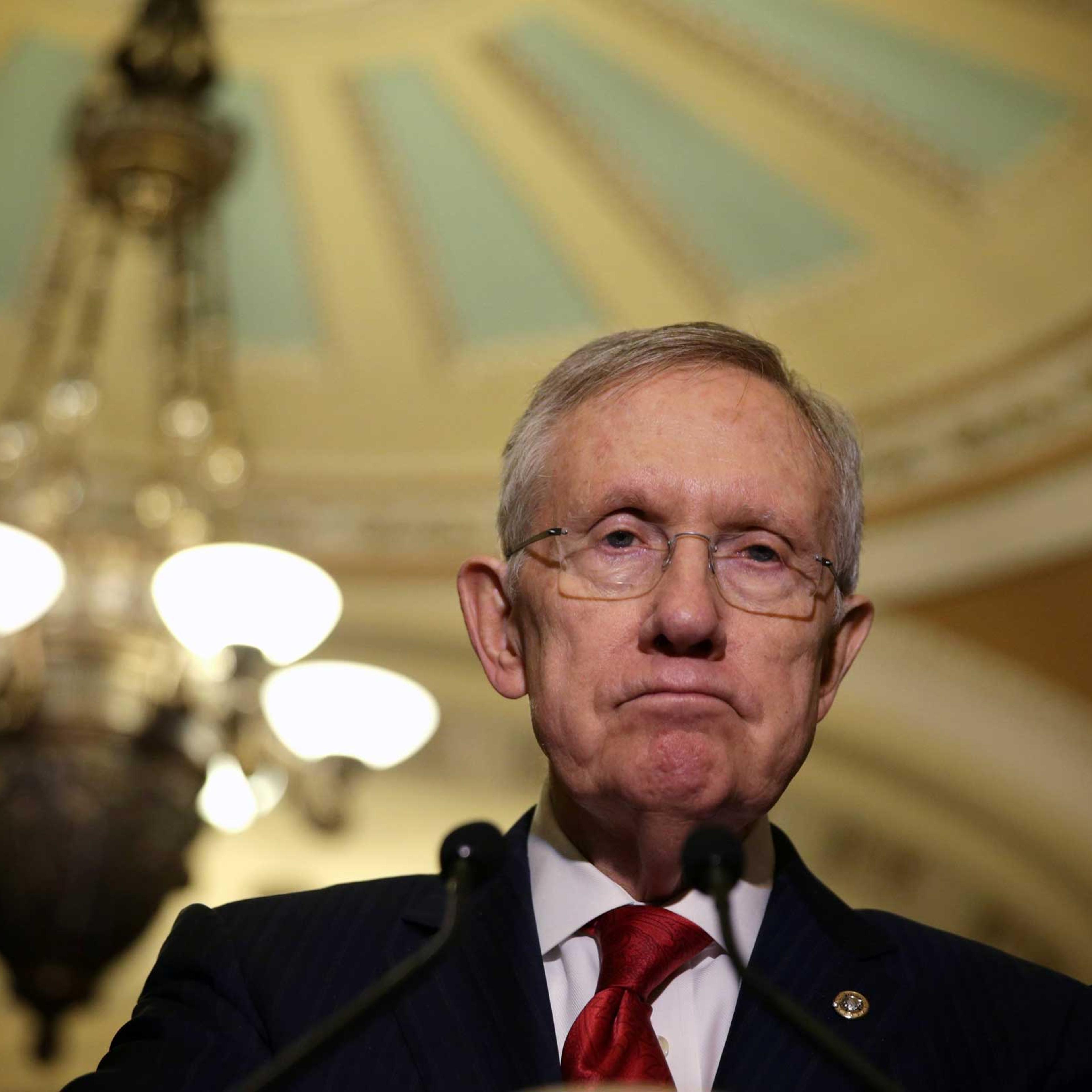 Senate Majority Leader Sen. Harry Reid speaks to members of the media after the Senate Democratic Policy Luncheon at the Capitol Dec. 9, 2014 on Capitol Hill in Washington, DC.