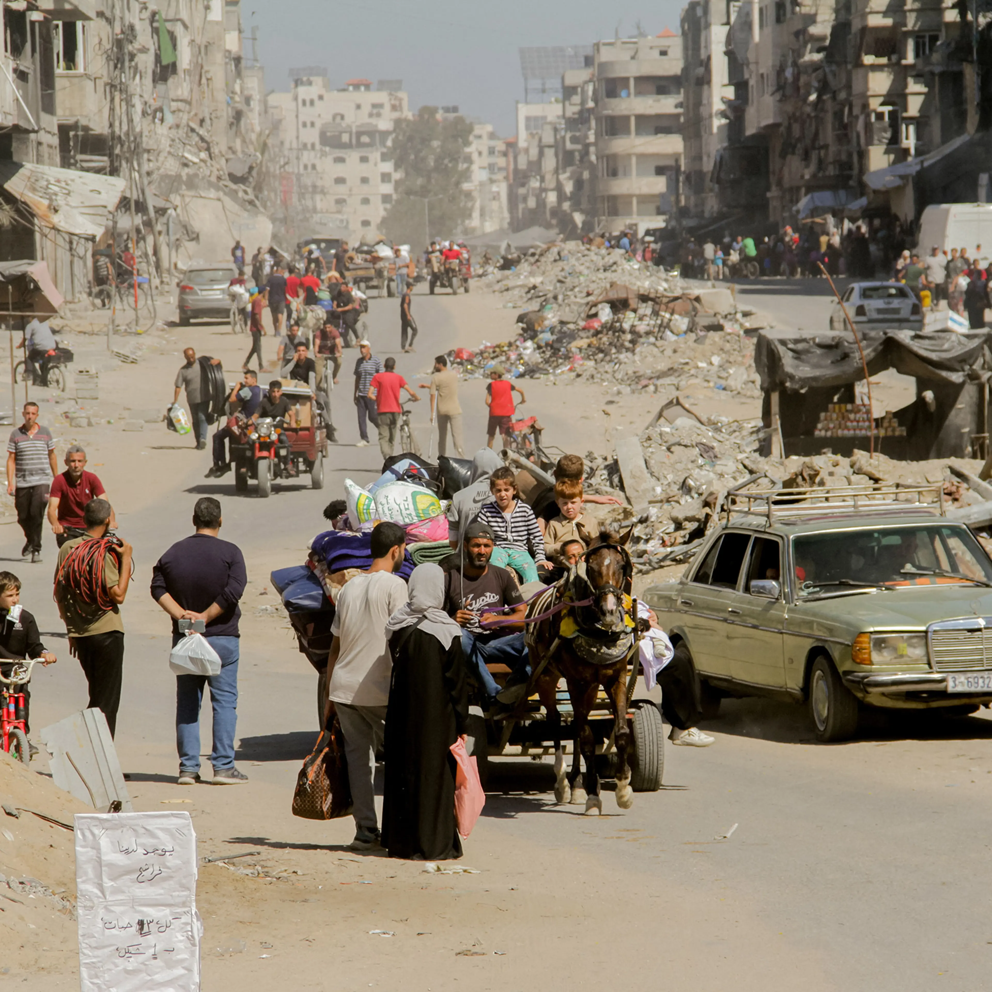 Palestinians carry their belongings as they flee areas north of Gaza City in the northern Gaza Strip on Oct. 12, 2024.