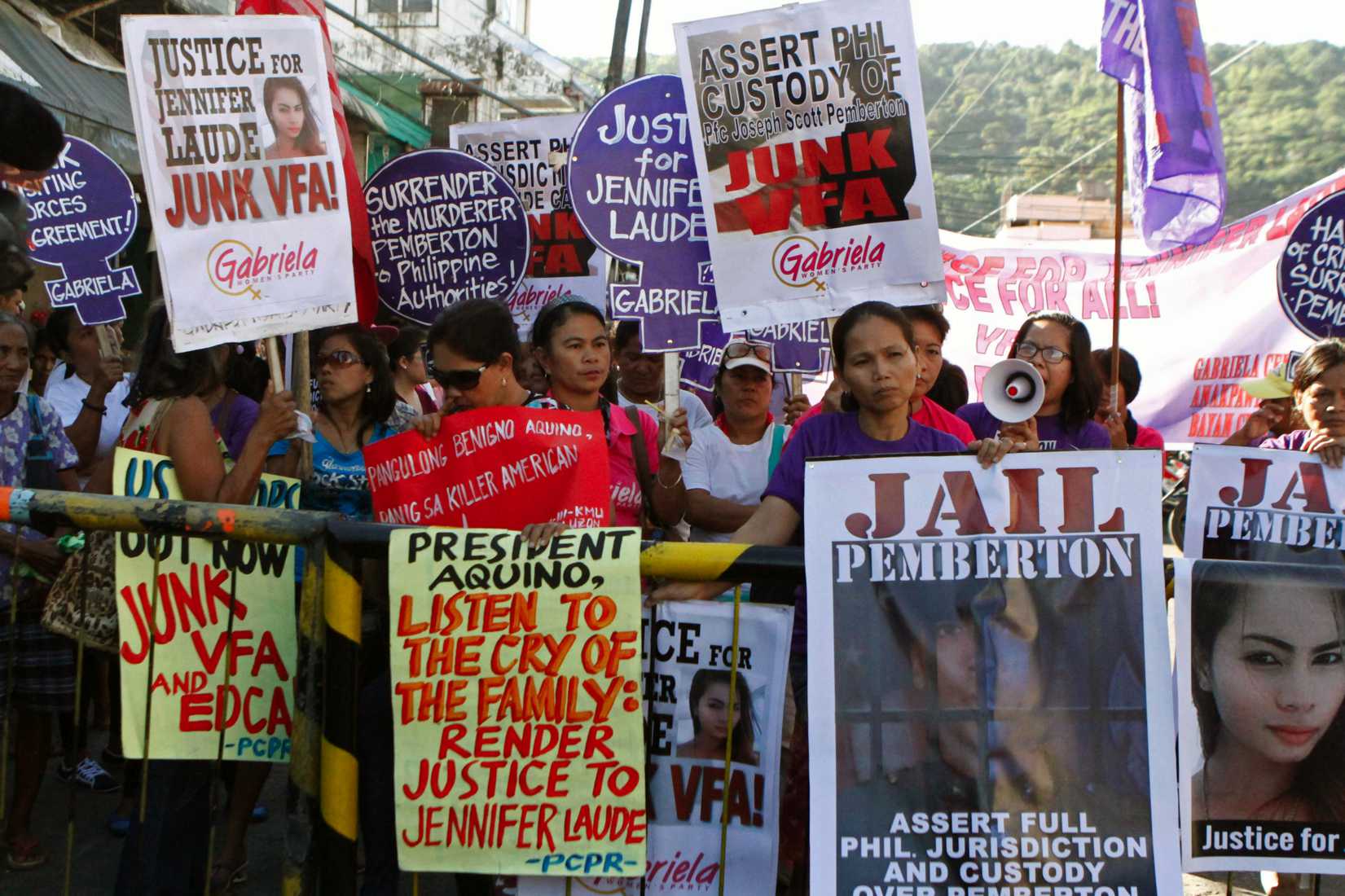 Activists participate in a protest to seek justice for a Filipina transgender Jennifer Laude outside a justice hall where a preliminary investigation was held at the Philippine city of Olongapo, north of Manila, on Oct. 27, 2014 