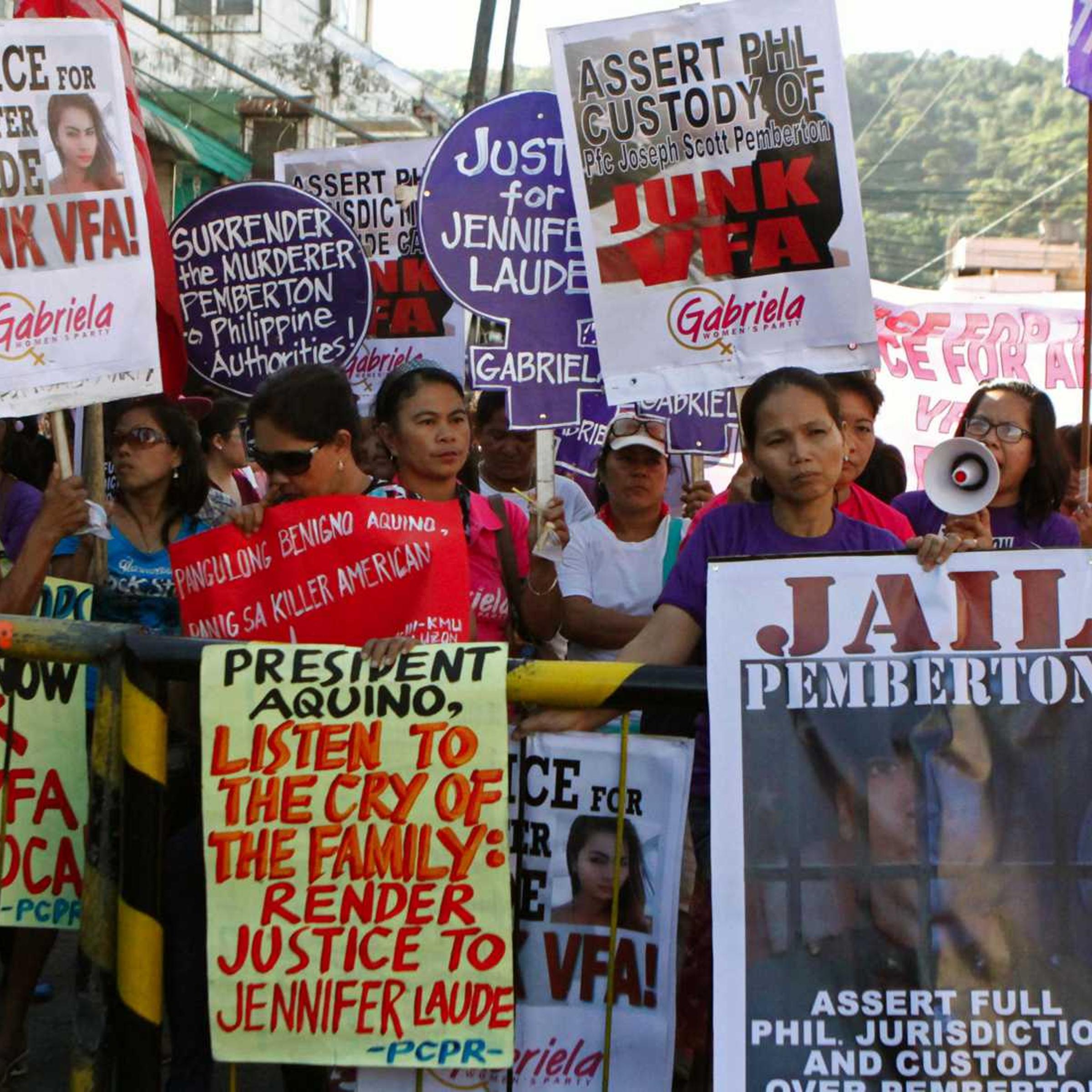 Activists participate in a protest to seek justice for a Filipina transgender Jennifer Laude outside a justice hall where a preliminary investigation was held at the Philippine city of Olongapo, north of Manila, on Oct. 27, 2014