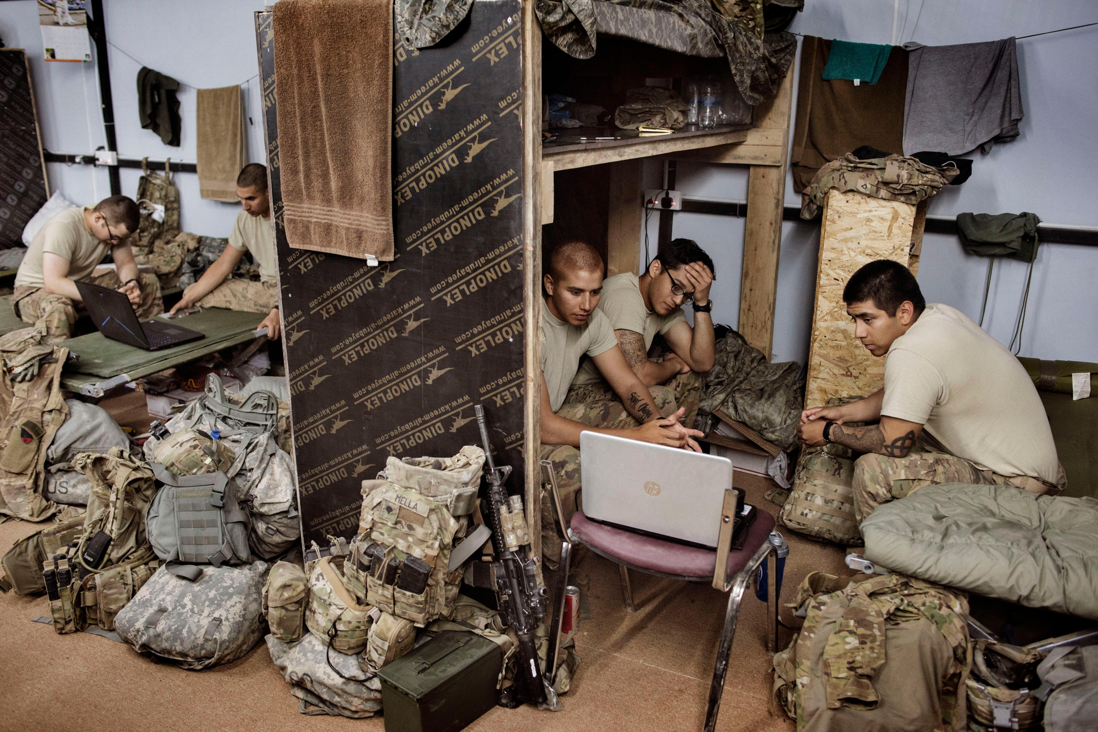 Members of the U.S. Army relax inside a makeshift barracks at Camp Swift, a U.S. forward base near the Iraqi town of Makhmour, Iraq, May 17, 2016. As of April, at least 4,087 U.S. military personnel were deployed in Iraq, many of them backing Iraqi force