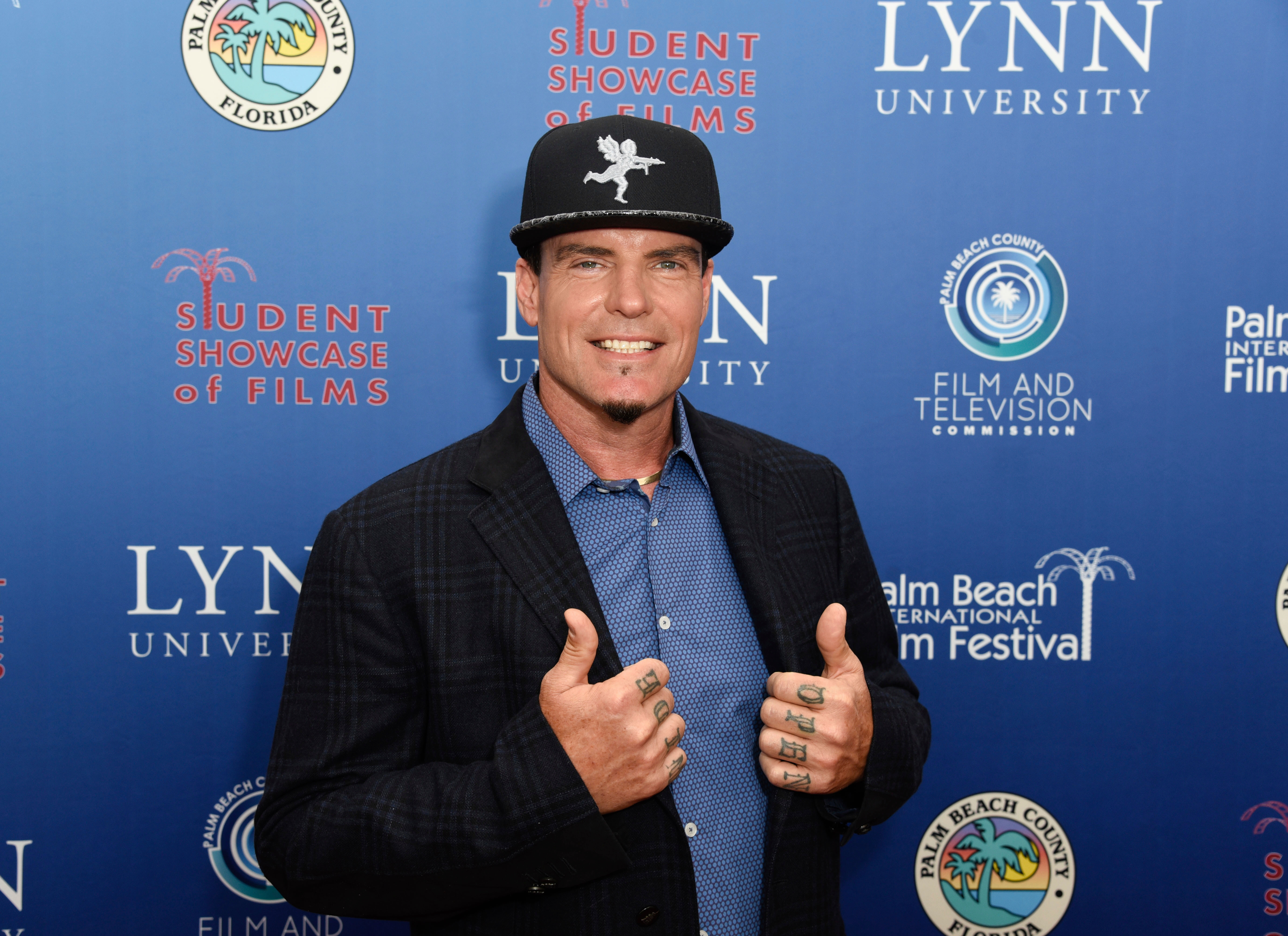 Vanilla Ice poses