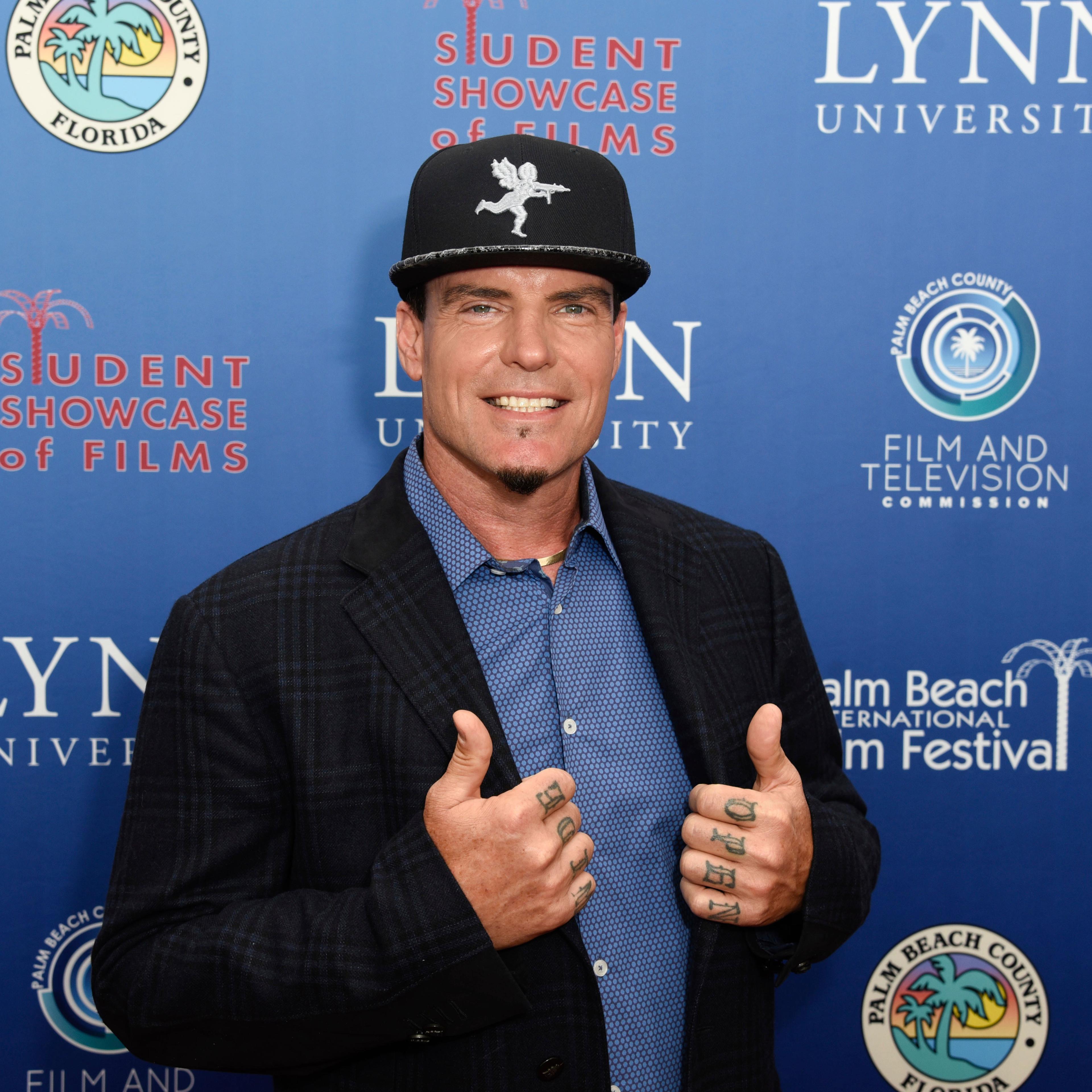 Vanilla Ice poses