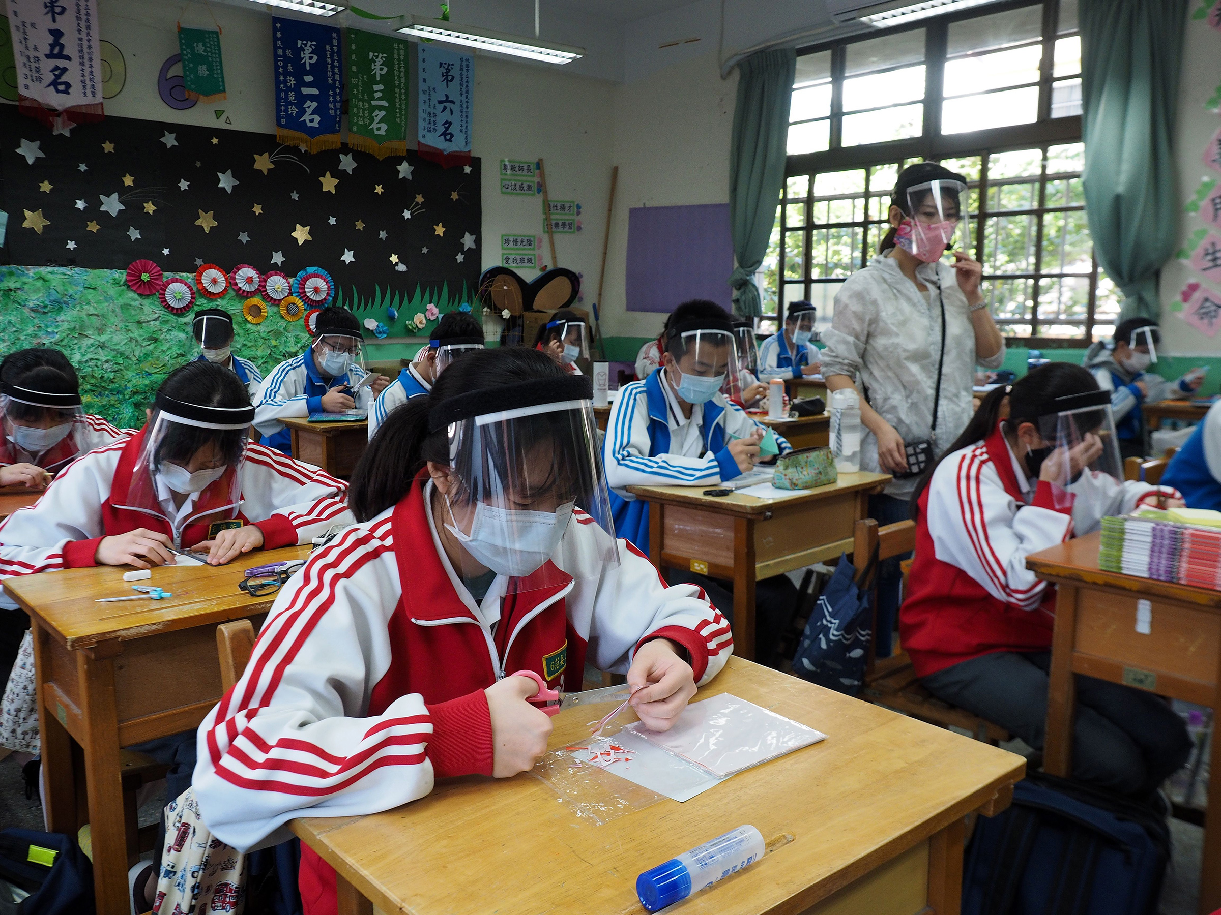 Taiwan: Fewer than 500 cases have been
confirmed on the island of 23 million, where students in a plastic-arts class seen on April 28
learned to make
face shields