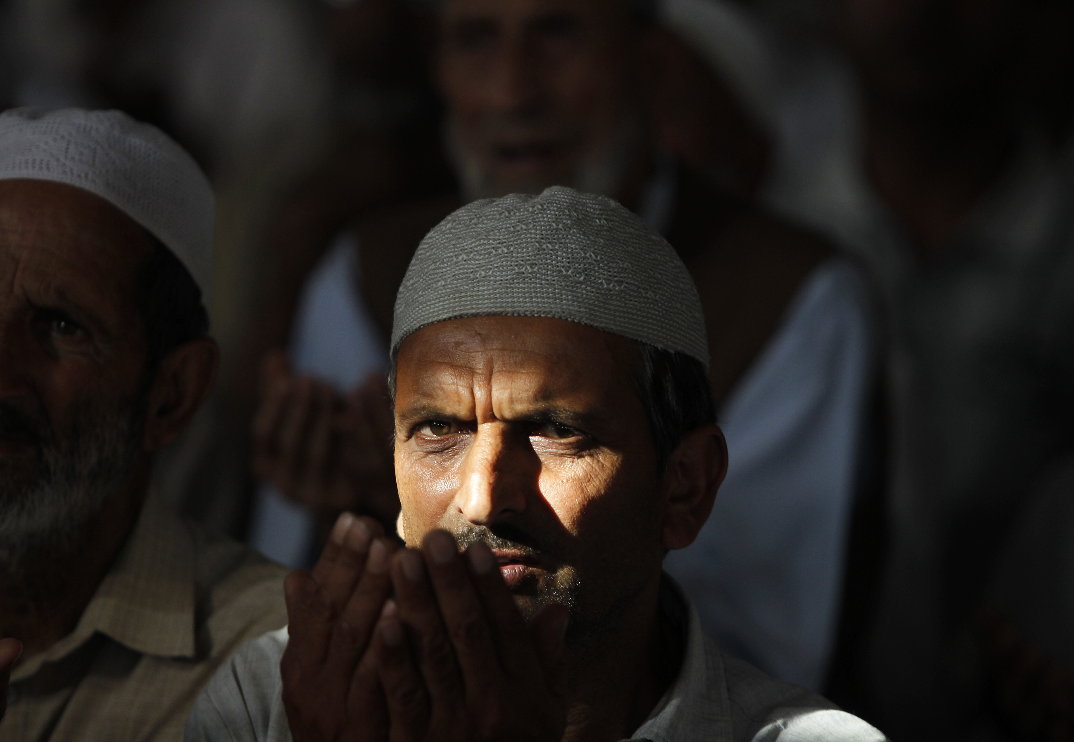 A Kashmiri Muslim man prays inside the shrine of a Sufi saint during the holy month of Ramadan in Srinagar