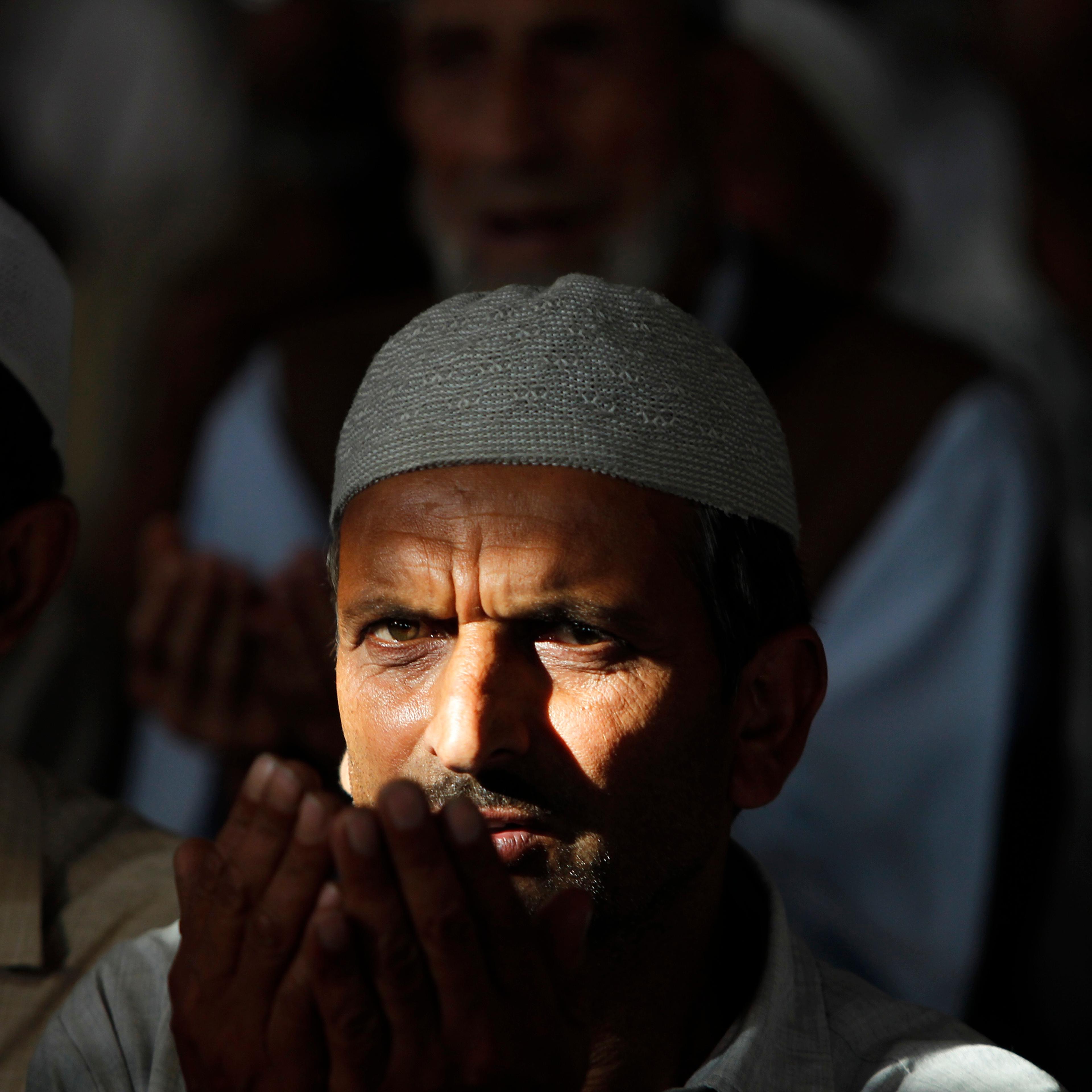 A Kashmiri Muslim man prays inside the shrine of a Sufi saint during the holy month of Ramadan in Srinagar