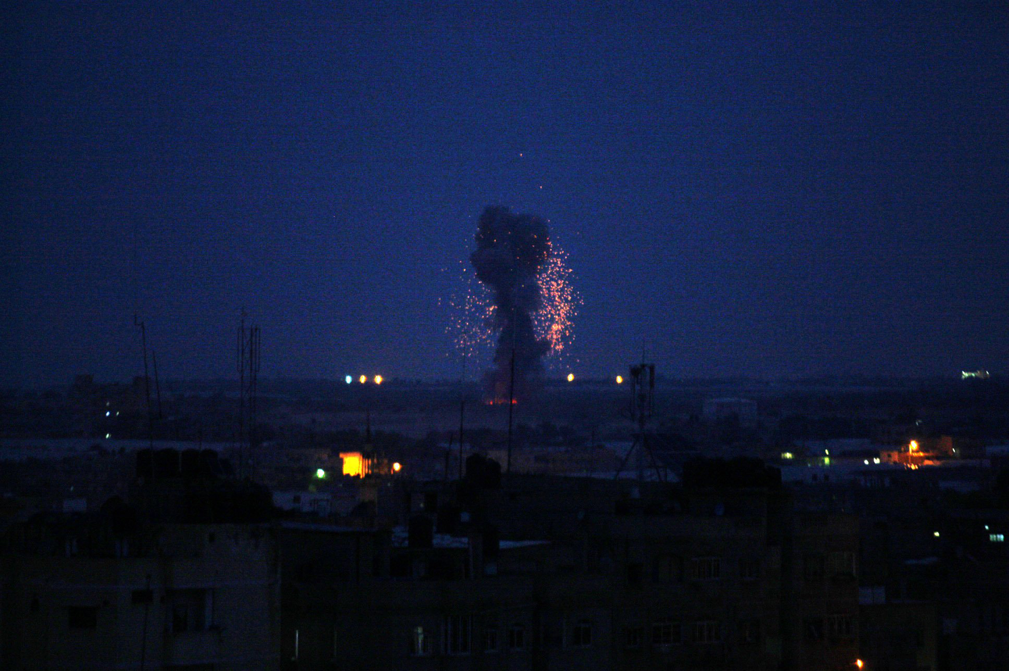 An explosion caused by Israeli airstrikes is seen on Gaza City, early March 15, 2019, in response to a rare rocket attack on the Israeli city of Tel Aviv.