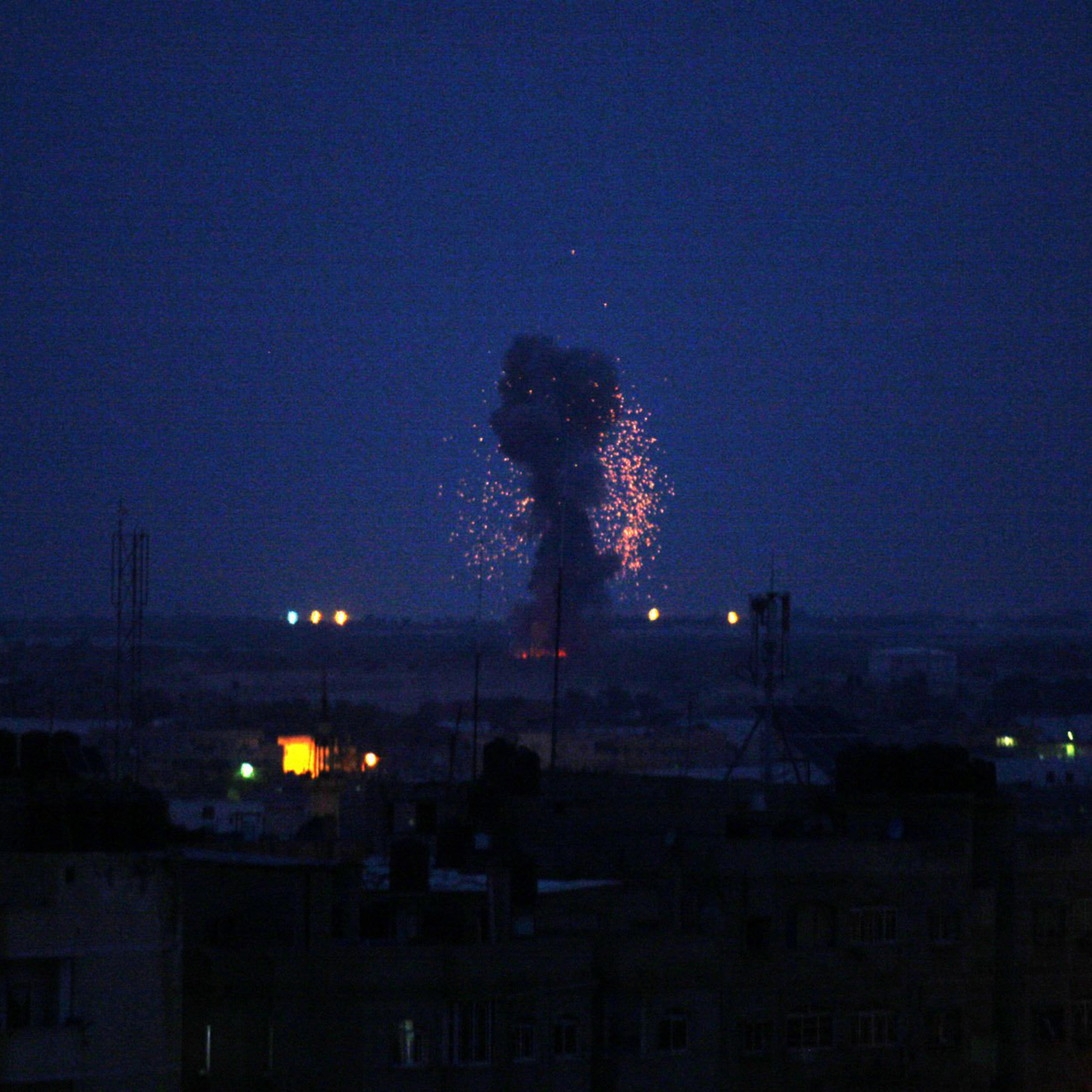 An explosion caused by Israeli airstrikes is seen on Gaza City, early March 15, 2019, in response to a rare rocket attack on the Israeli city of Tel Aviv.