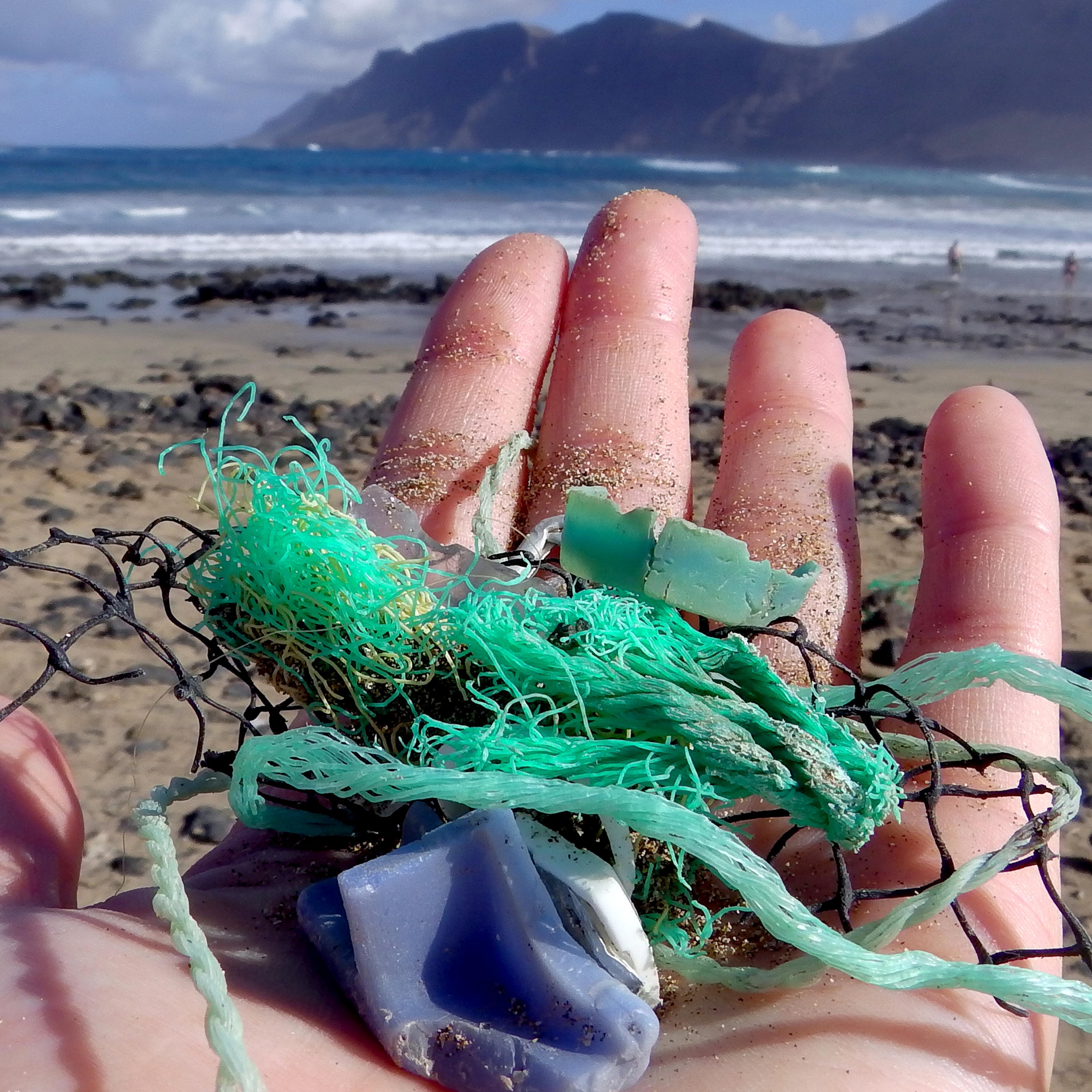Study author Jenna Jambeck of the University of Georgia collects plastic samples from a beach near Caleta de Famara, Canary Islands, Spain.