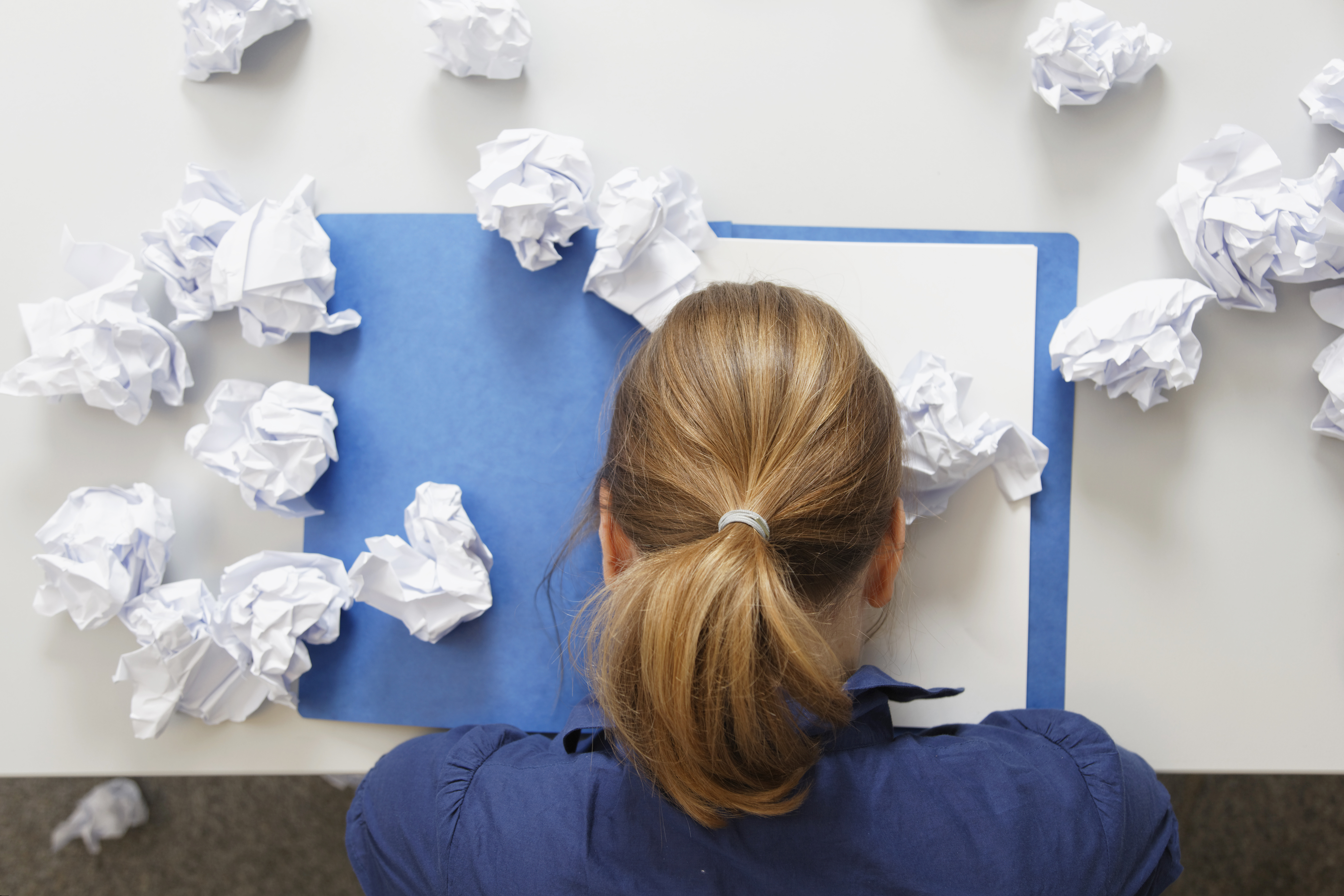 Germany, Businesswoman with file on table